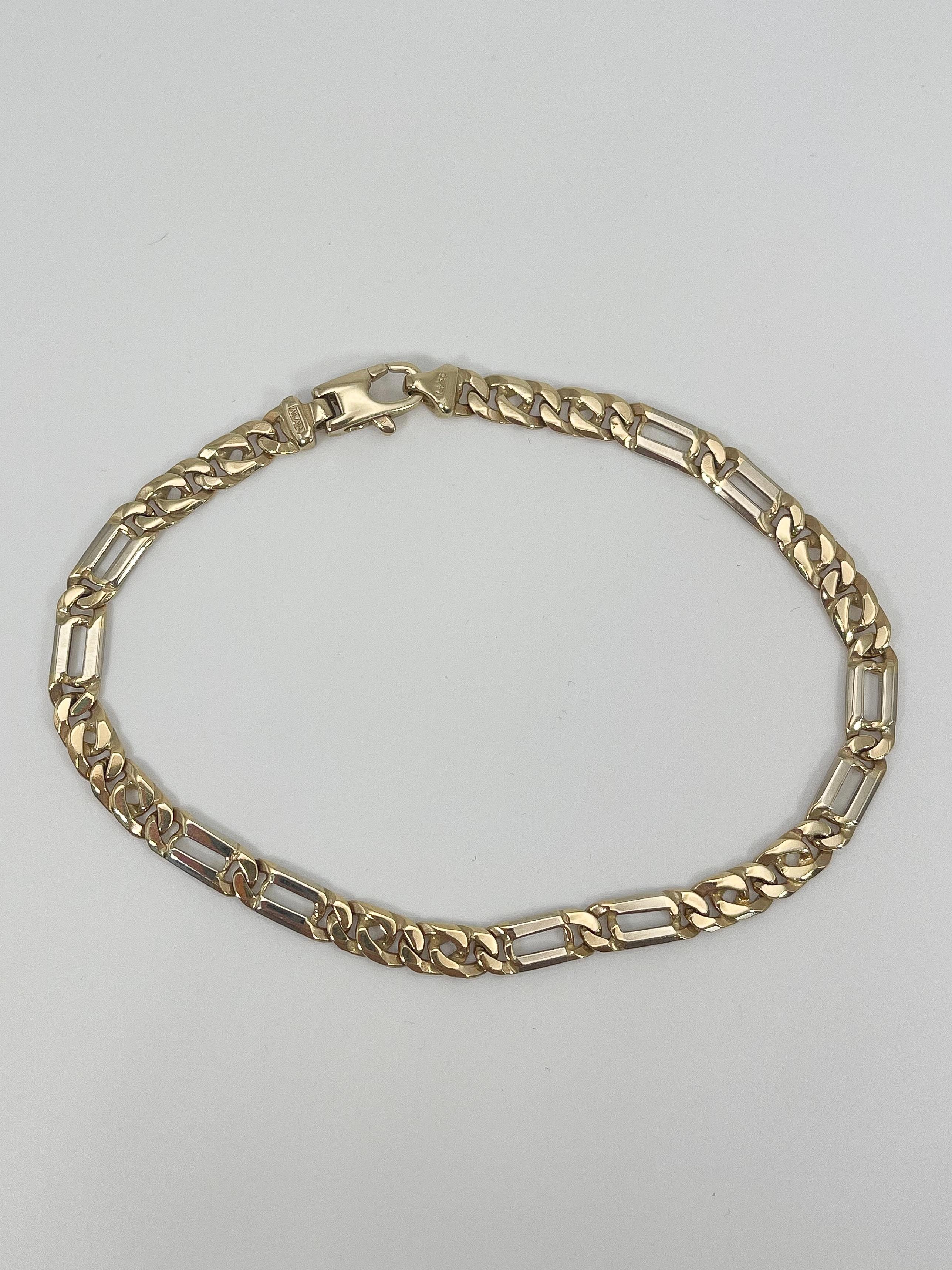 14k yellow gold men's fancy link bracelet. The length of this bracelet is 8 1/2 inches, the width is 4.9 mm, has a lobster clasp to open and close, and it has a total weight of 12.5 grams.