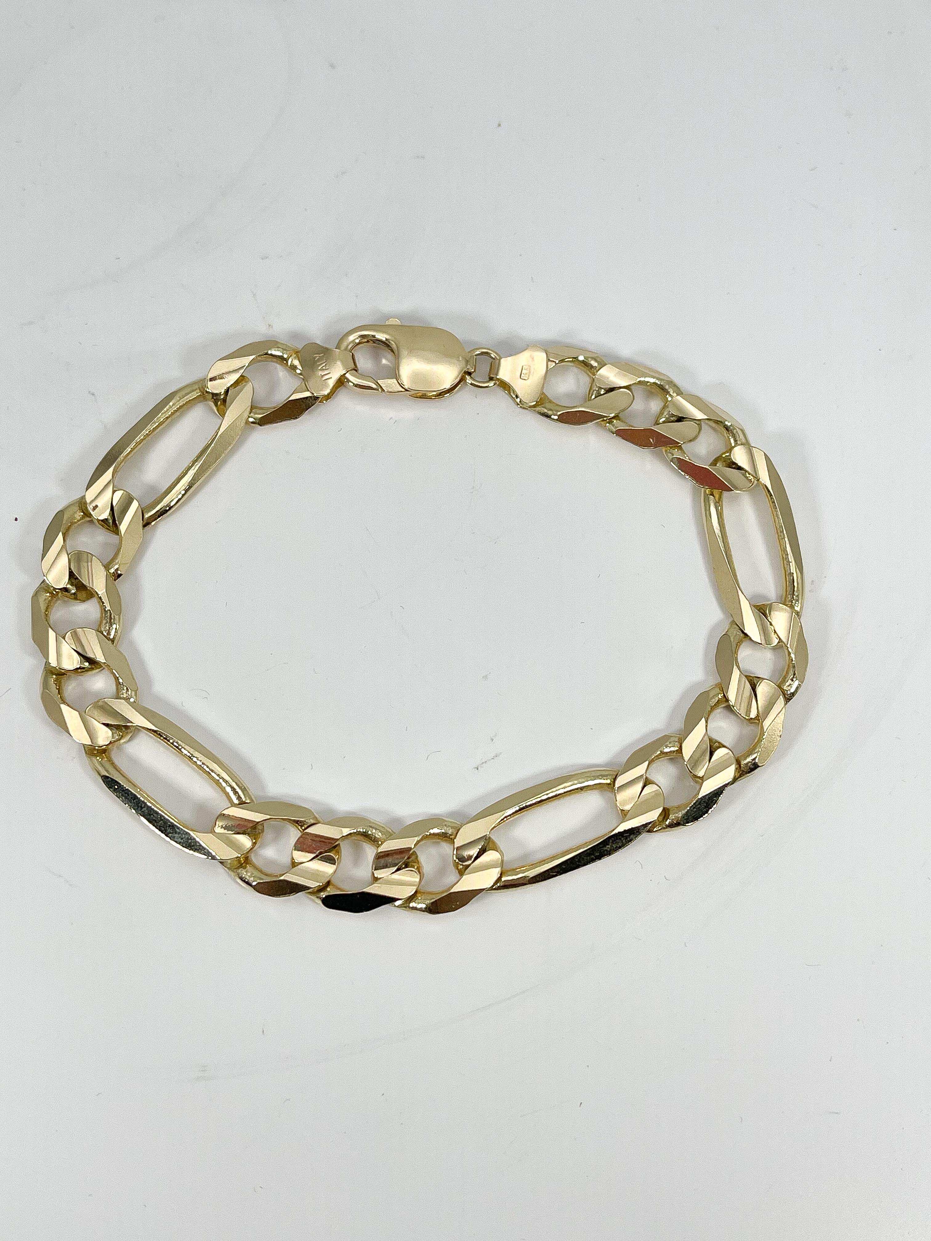 14k yellow gold men's heavy figuero bracelet. The length of this bracelet is 8 1/2 inches, the width measures 9.8 mm, has a lobster clasp to open and close, and it has a total weight of 27.3 grams.