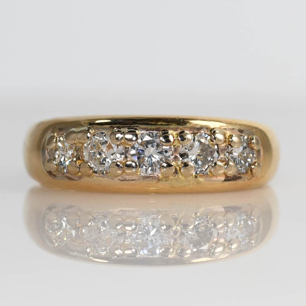 Men's vintage diamond wedding band in 14k yellow gold.
Tests 14k and weighs 7.3 grams.
The diamonds are round brilliant cuts, .75 total carats, H to i color, Vs to Si clarity.
The ring measures 7mm wide at the top.
Ring size is 7 and can be sized,