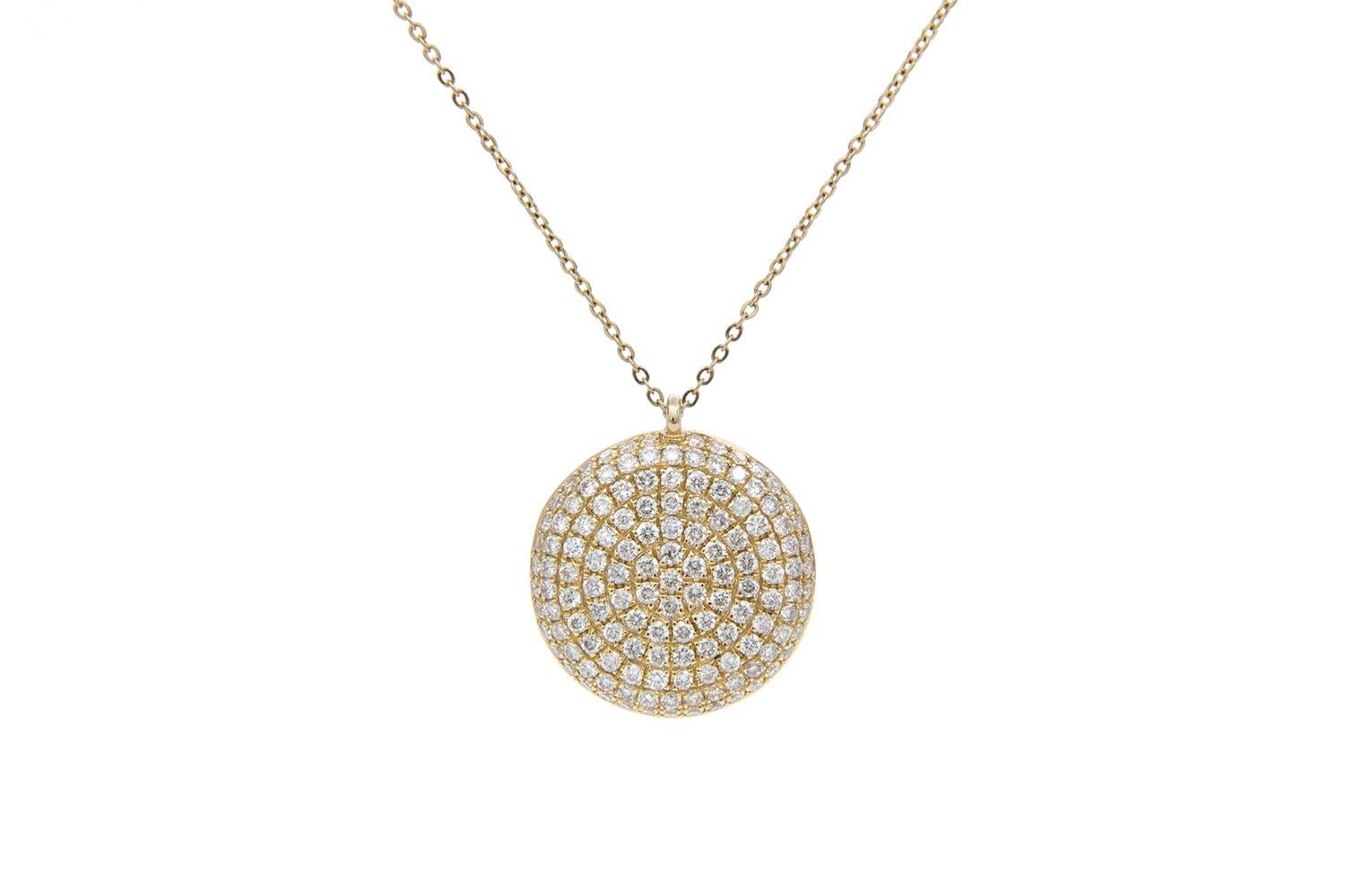We are pleased to present this 14k Yellow Gold & Micro Pave Diamond Puffy Disc Pendant Necklace. This cute piece features 0.74ctw G-H/VS-SI round brilliant cut diamonds set in a disk shaped pendant on a 14k yellow gold chain. The chain is 18