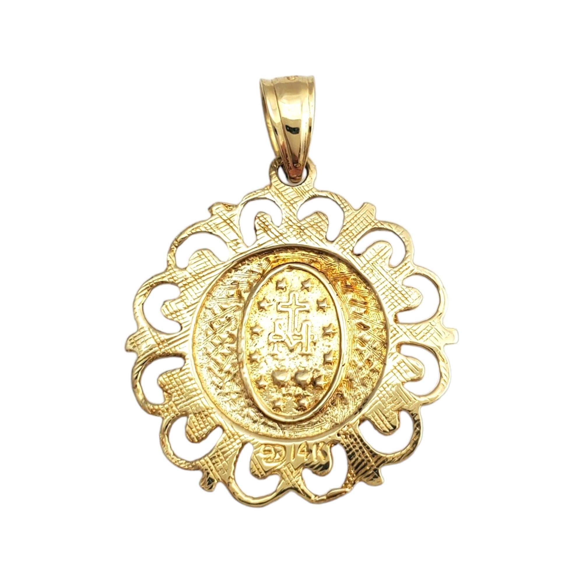 Vintage 14 karat yellow gold miraculous medal pendant -

This lovely miraculous medal pendant is set in beautifully detailed 14K yellow gold.

Size: 19.8mm x 1.9mm

Stamped: 14K

Weight: 1.5 gr./ 0.9 dwt.

Chain not included.

Very good condition,