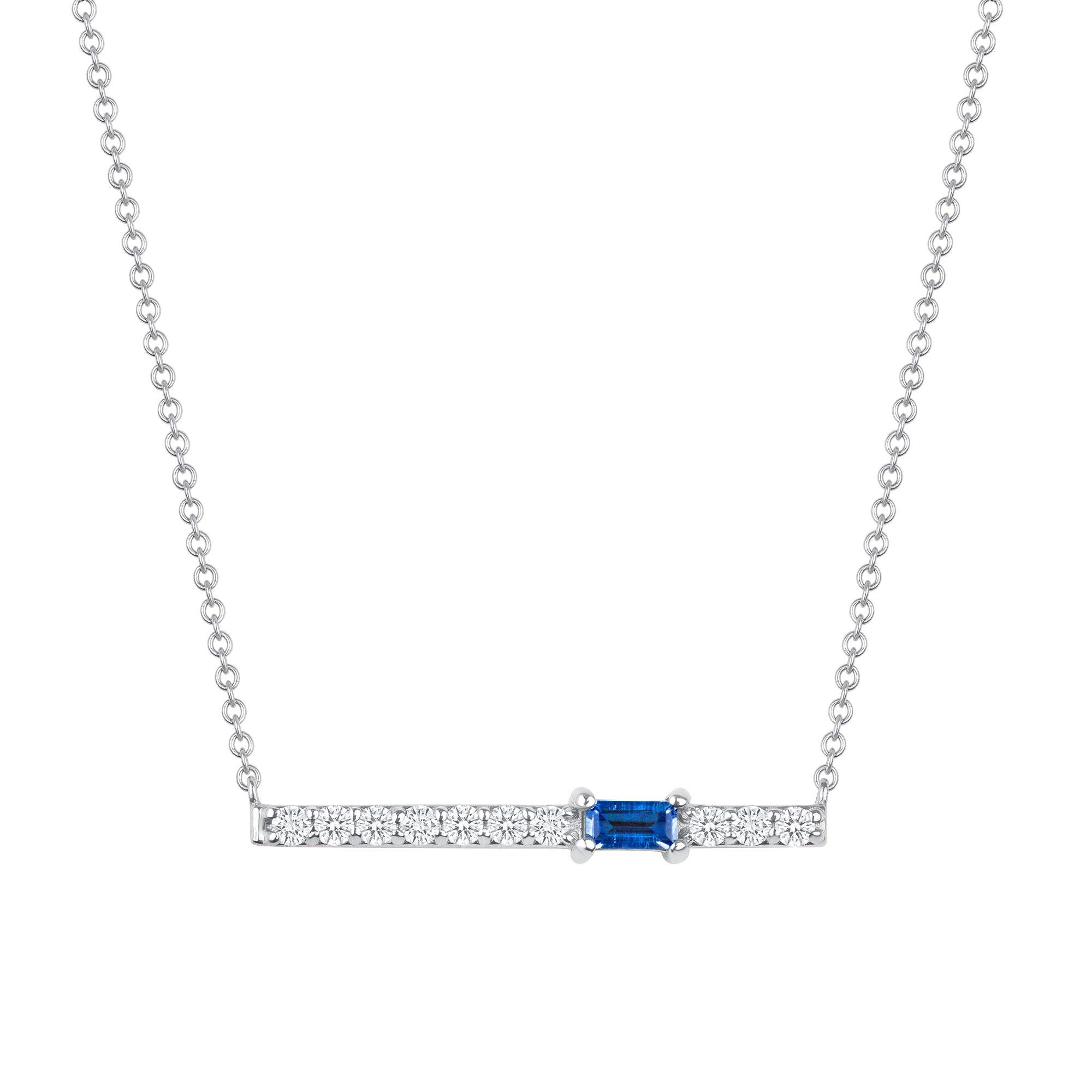 Crafted in 14K gold, round glistening diamonds enclose a baguette blue sapphire stone on this contemporary bar pendant. This stunning necklace is a modern piece that sits elegantly above the collarbone making it the perfect necklace for layering or