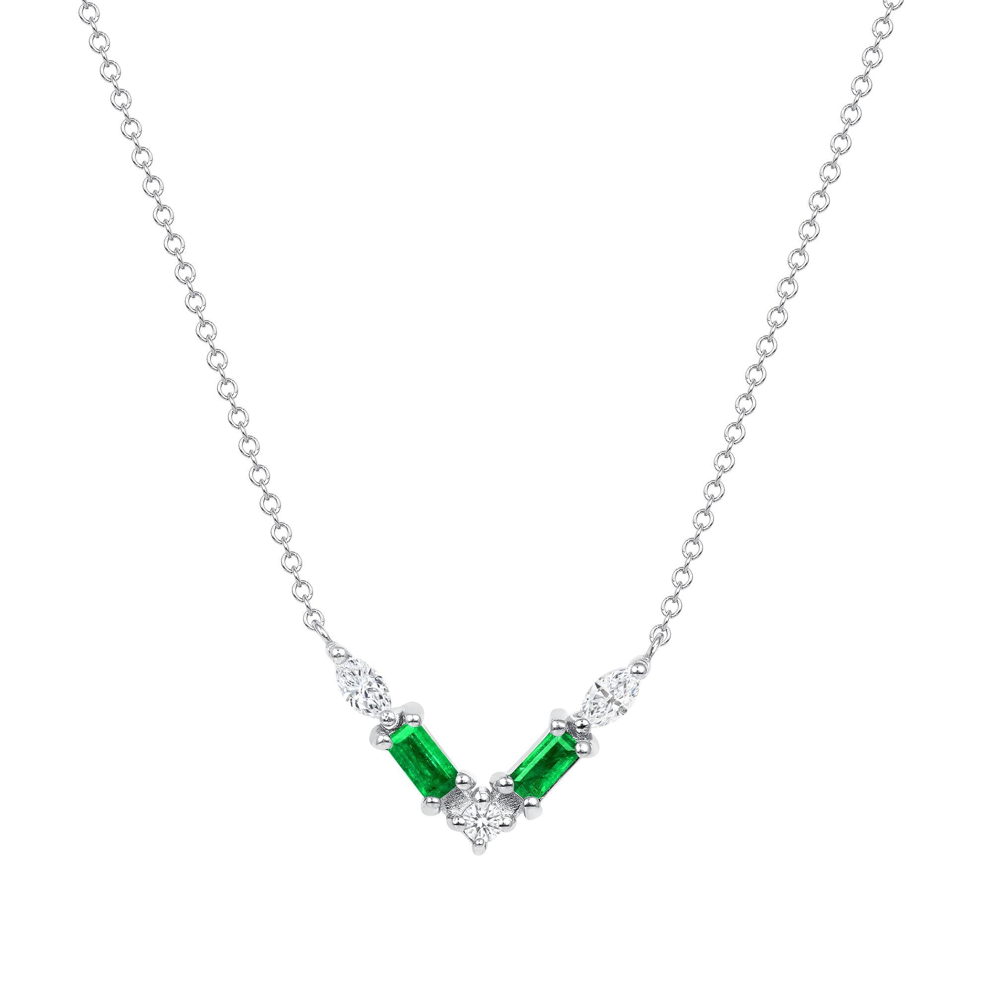 Crafted in 14K gold, this necklace features a thoughtfully arranged collection of emeralds and diamond pavé, elegantly set along a V-shaped plane. Crafted in 14K yellow gold, it exudes delicacy and emotion, showcasing a captivating color palette.