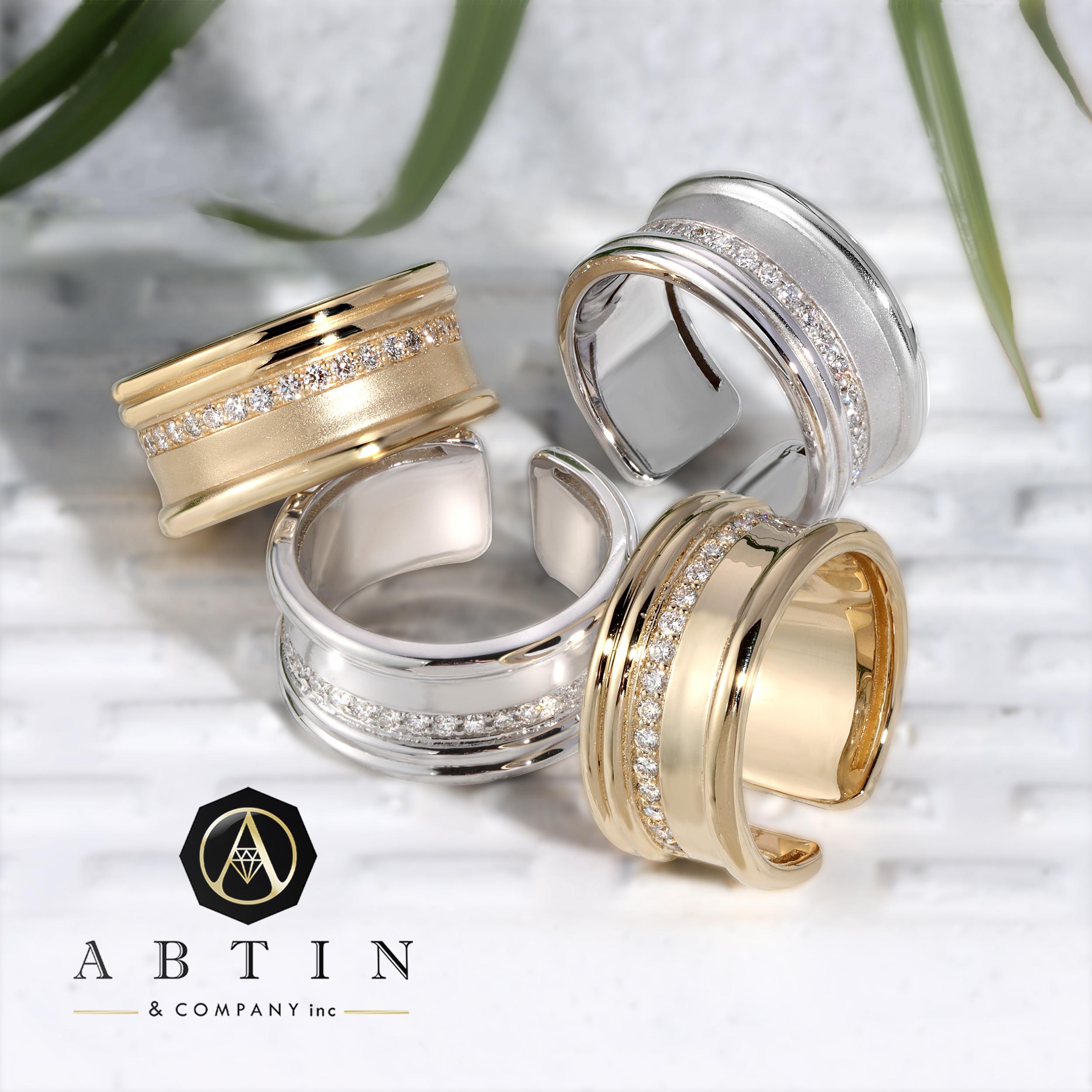 Crafted in 14K gold, this women's cigar ring showcases a timeless open design adorned with a shimmering line of round brilliant diamonds. Elevate your daily style with this captivating piece, perfect for both everyday wear and special occasions like