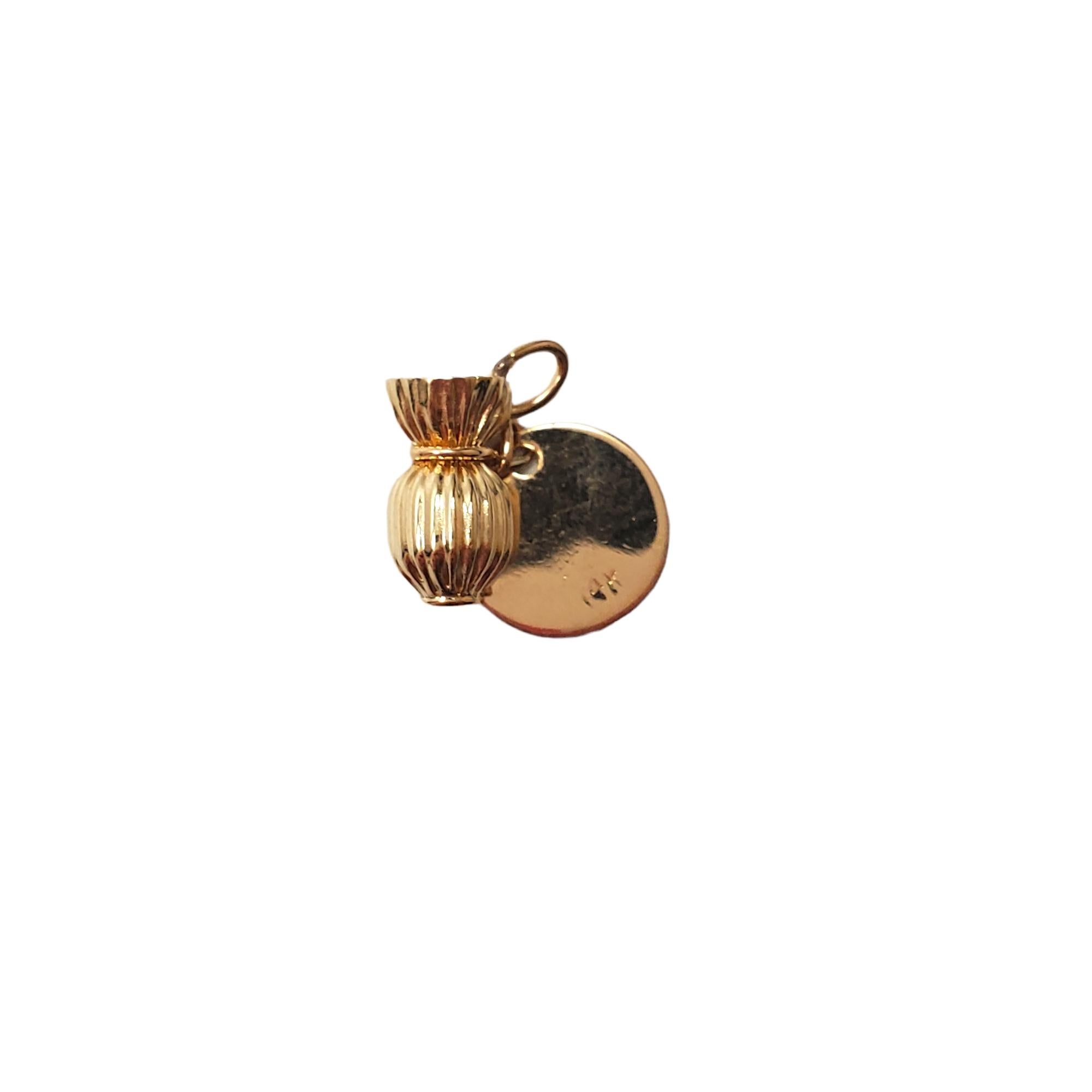 14K Yellow Gold Money Bag Charm

This meticulously detailed piece features a money bag charm with a dangling dollar sign symbol.

Size: 10.9 mm X 6.19 mm

Weight: 0.9 g/ 0.5 dwt

Hallmark: 14K

Very good condition, professionally polished.

Will