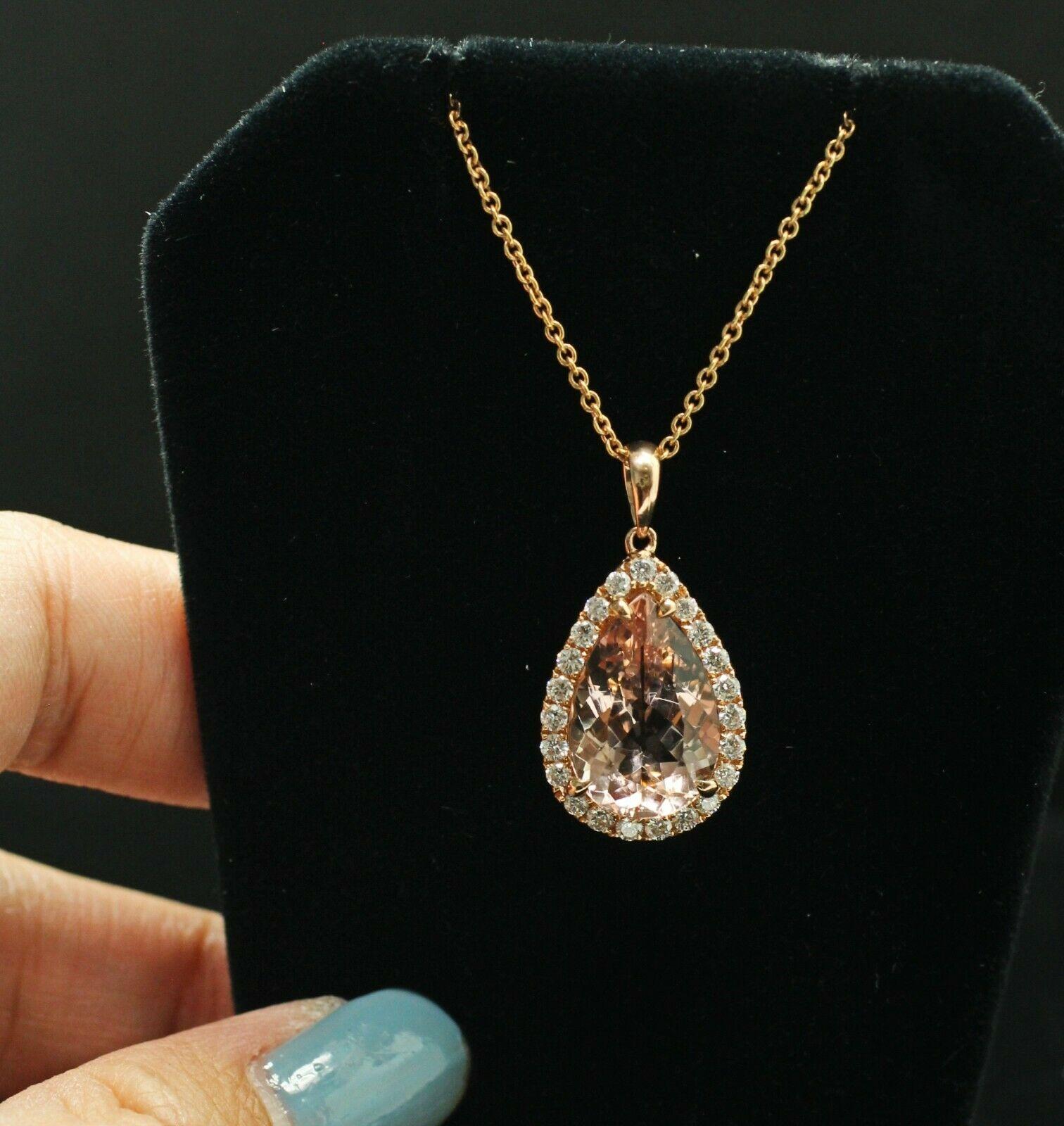  Surprise a special woman in your life with this large, breathtaking, statement halo morganite diamond necklace.This eye-catching pendant necklace features 0.46ct total weight of accent diamonds surrounding a 14.9mm-9.9mm pear cut Morganite, all set
