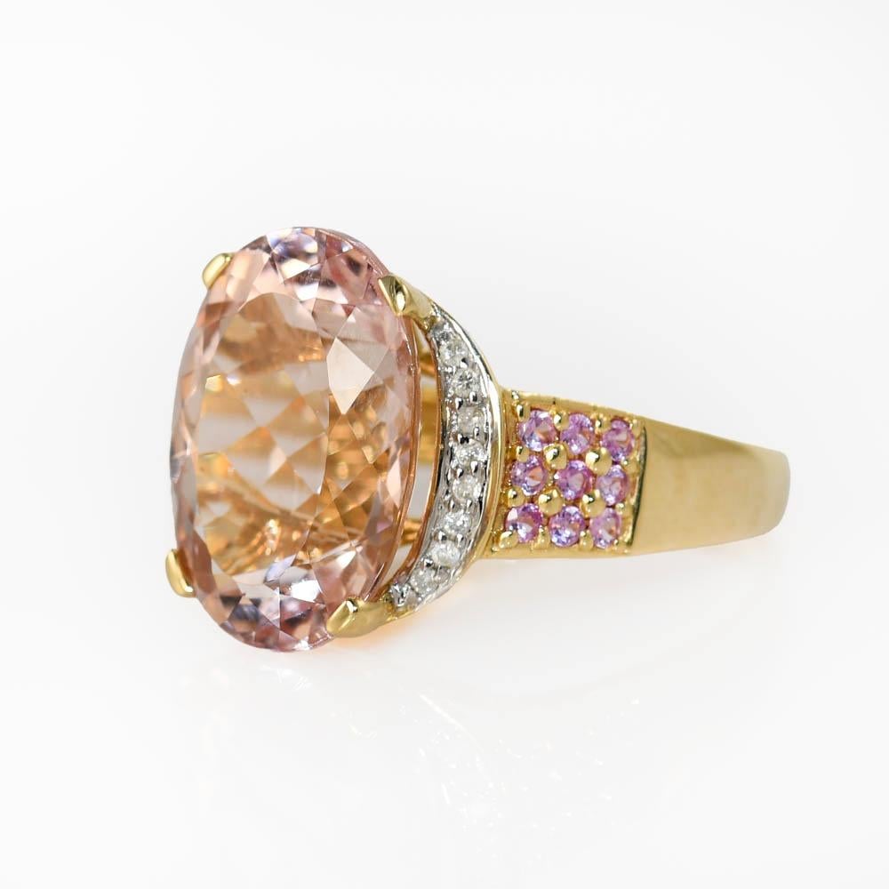 14K Yellow Gold Morganite Ring w Diamond, 5.8g
Ladies Morganite and gemstone ring with 14k yellow gold setting.

Stamped 14k and weighs 5.8 grams gross weight.

The oval shape morganite has a light pinkish-brown color, 8.50 carats.

On the sides are