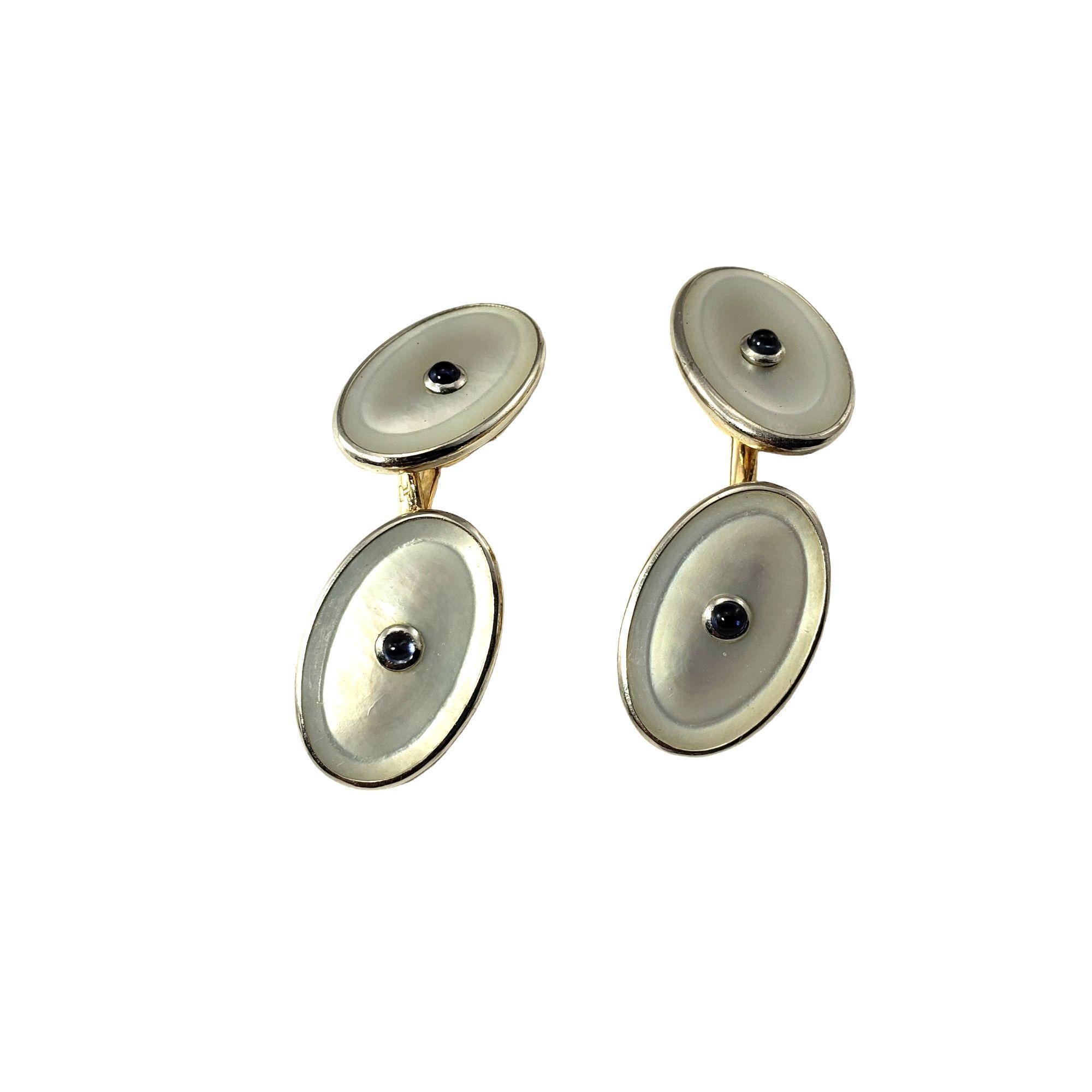 14 Karat Yellow Gold Mother of Pearl and Sapphire Cufflinks-

These elegant cufflinks are created in beautifully detailed mother of pearl set in 14K yellow folder. Accented with two cabochon sapphires. 

Size: 18 mm x 12 mm

Weight: 5.7 dwt. / 8.8