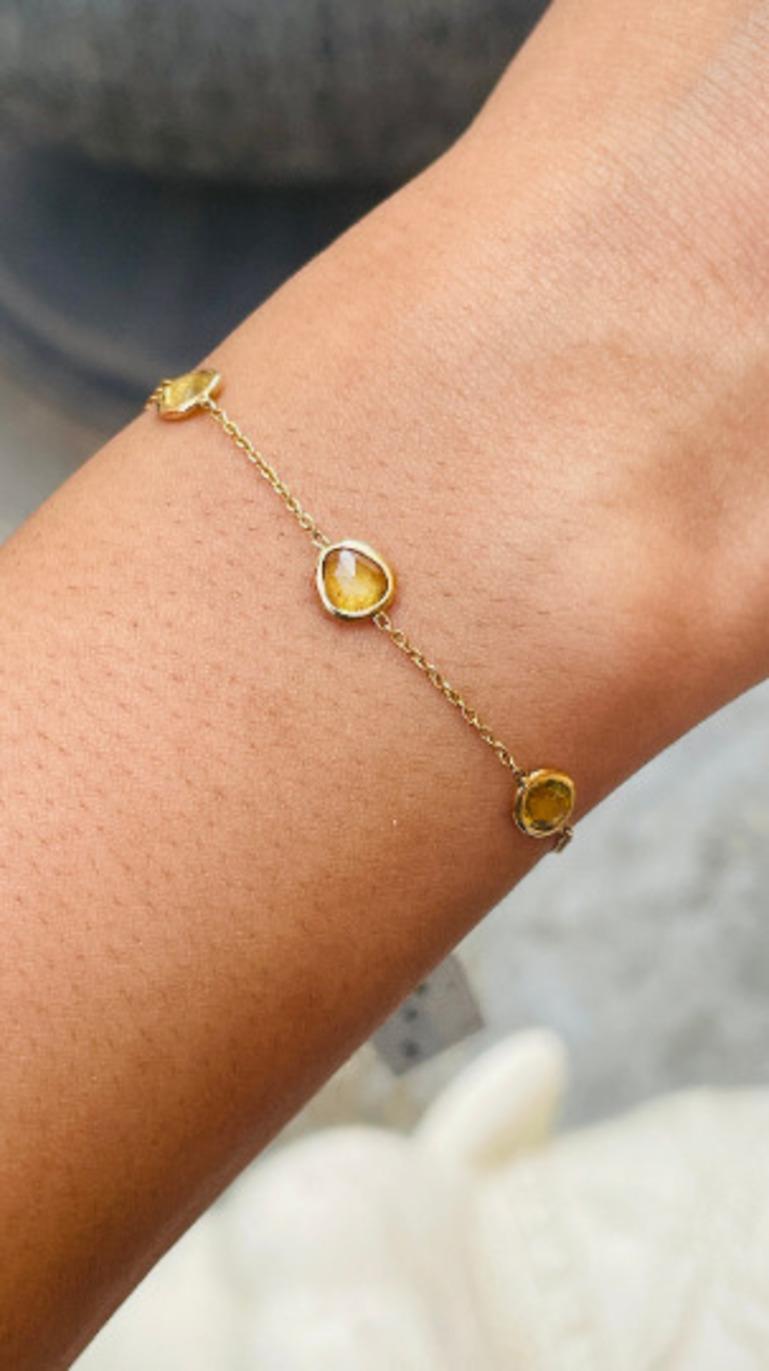 This Delicate Yellow Sapphire Stacking Chain Bracelet in 14K gold showcases 6 endlessly sparkling natural sapphire, weighing 3.42 carats. It measures 7 inches long in length. Sapphire stimulates concentration and reduces stress.
Designed with uneven
