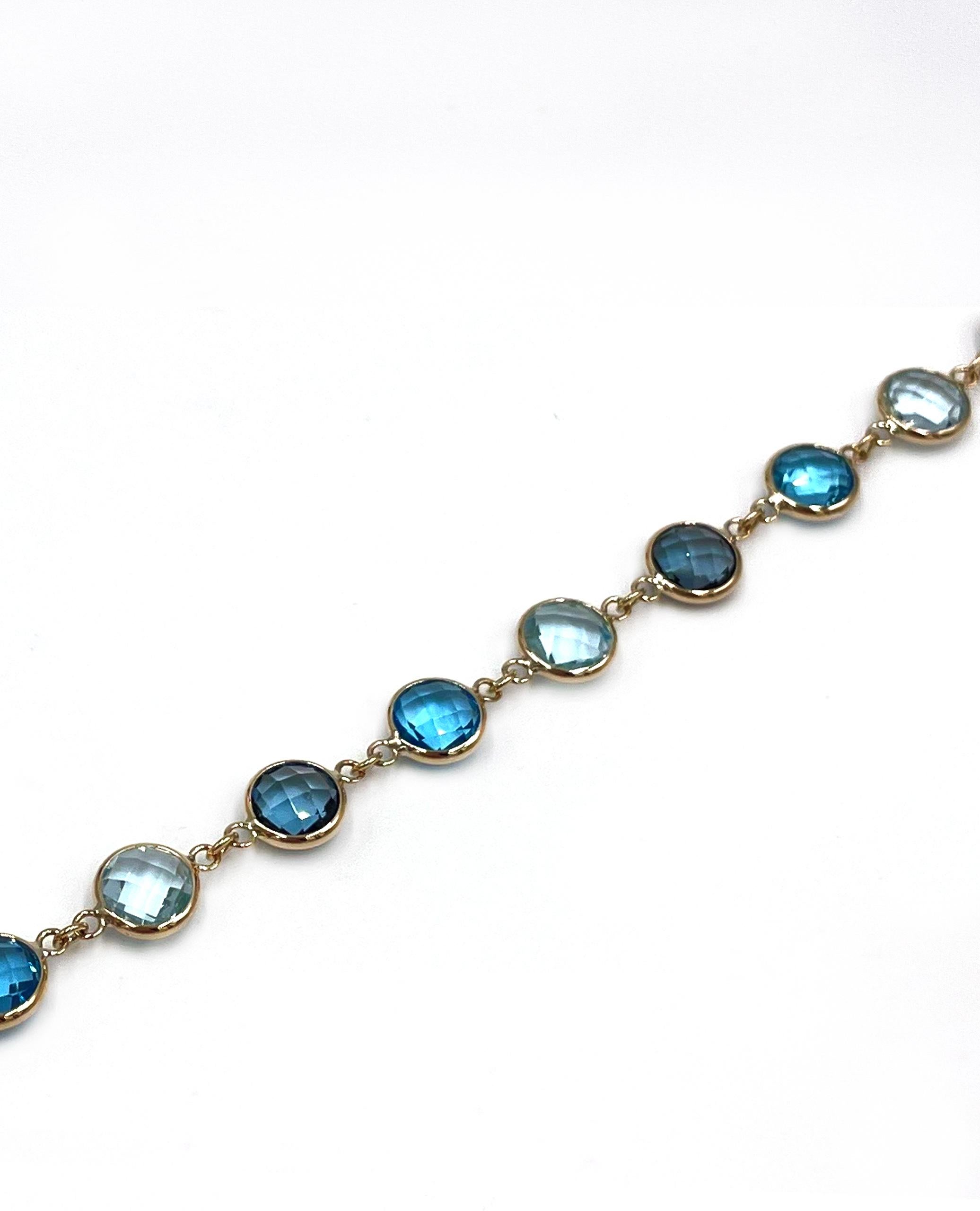 Contemporary 14K Yellow Gold Multi Hue Round Blue Topaz Riviera Bracelet with Extender For Sale