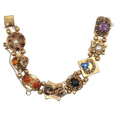 Bracelet en or jaune 14K à breloques multiples Perles Rubis Saphirs, 1930