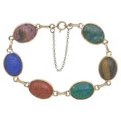 Bracciale a maglie con intagli e pietre preziose in oro giallo 14 carati