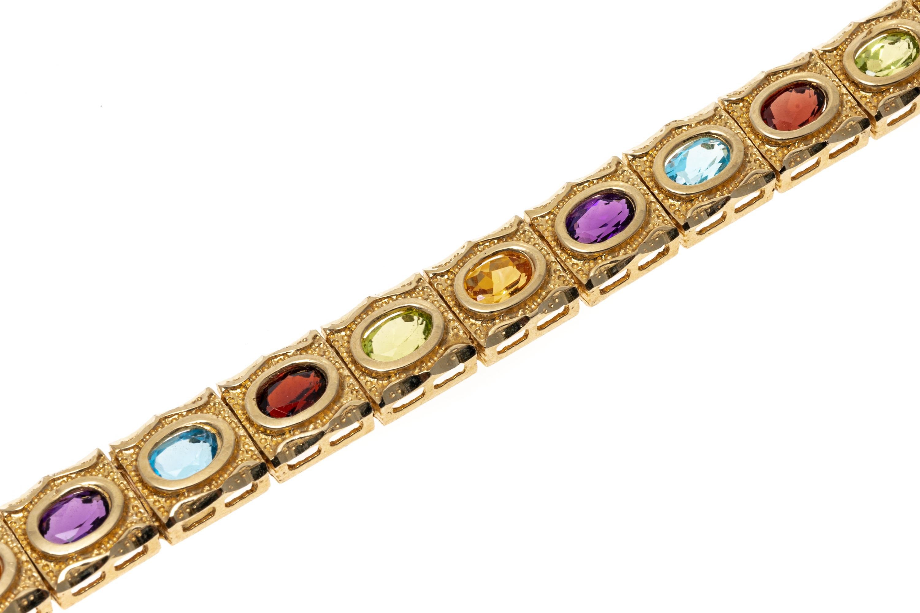Contemporary 14K Yellow Gold Citrine, Amethyst, Blue Topaz, Garnet and Peridot Line Bracelet For Sale