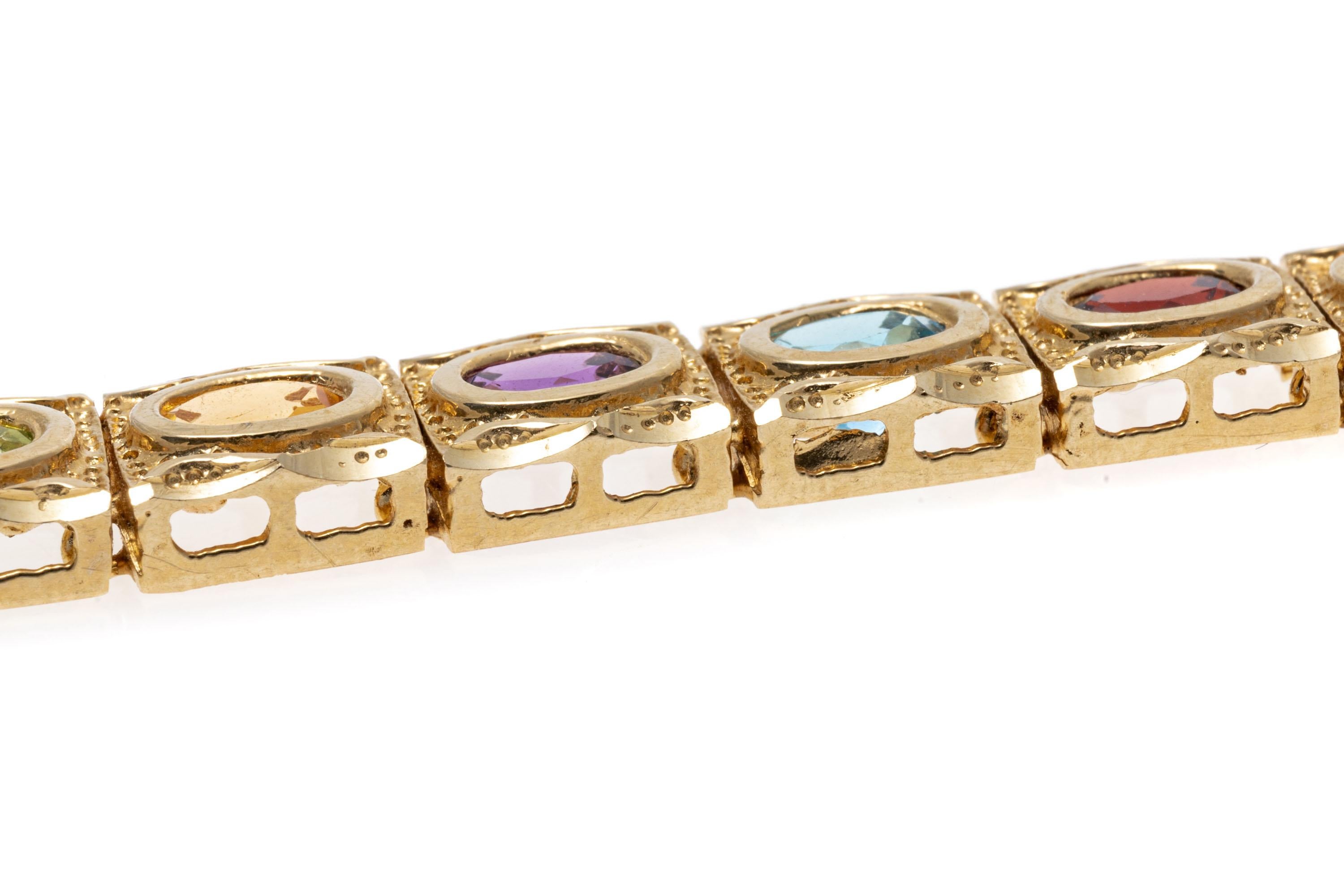 Oval Cut 14K Yellow Gold Citrine, Amethyst, Blue Topaz, Garnet and Peridot Line Bracelet For Sale