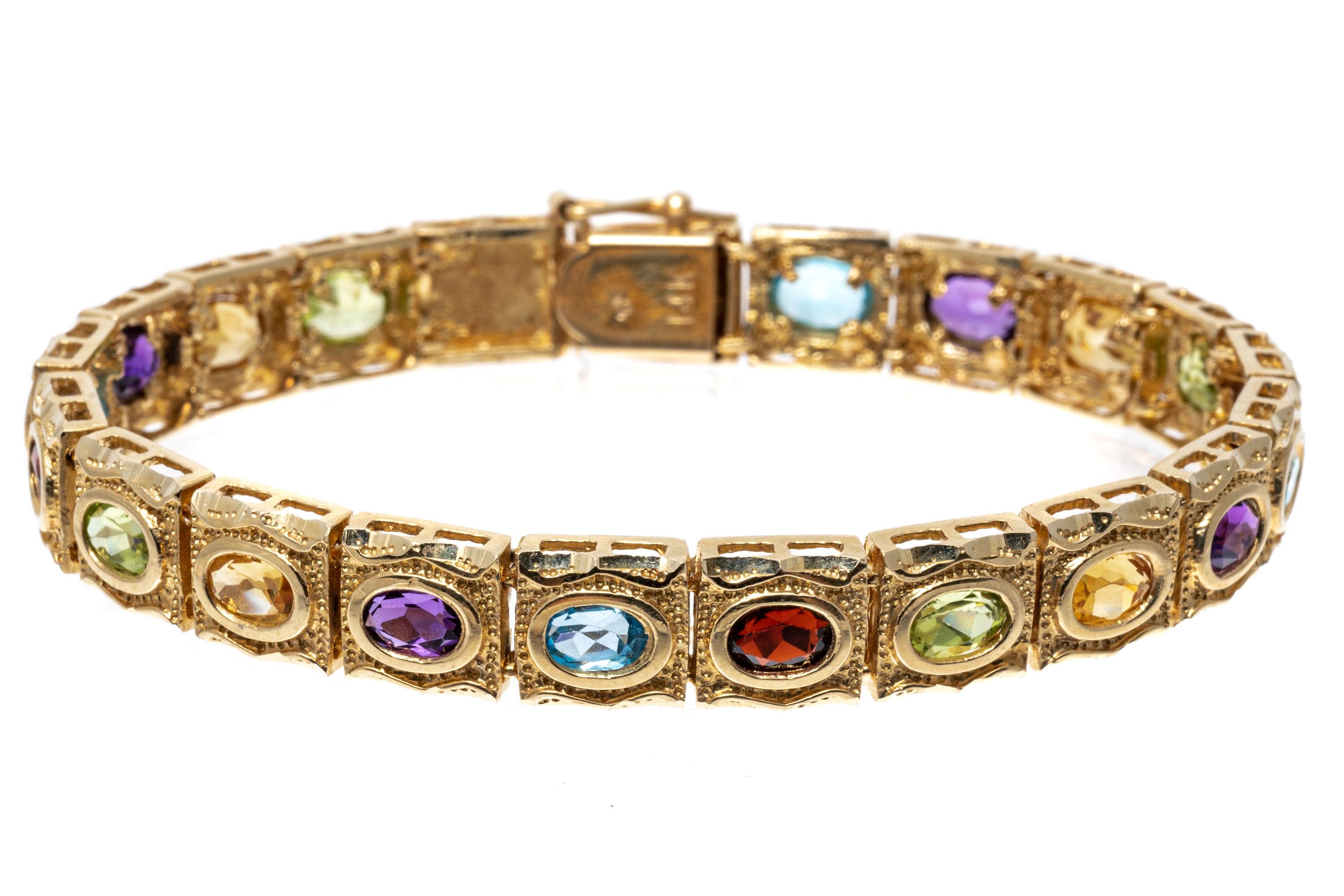 14K Yellow Gold Citrine, Amethyst, Blue Topaz, Garnet and Peridot Line Bracelet In Good Condition For Sale In Fairfield, CT