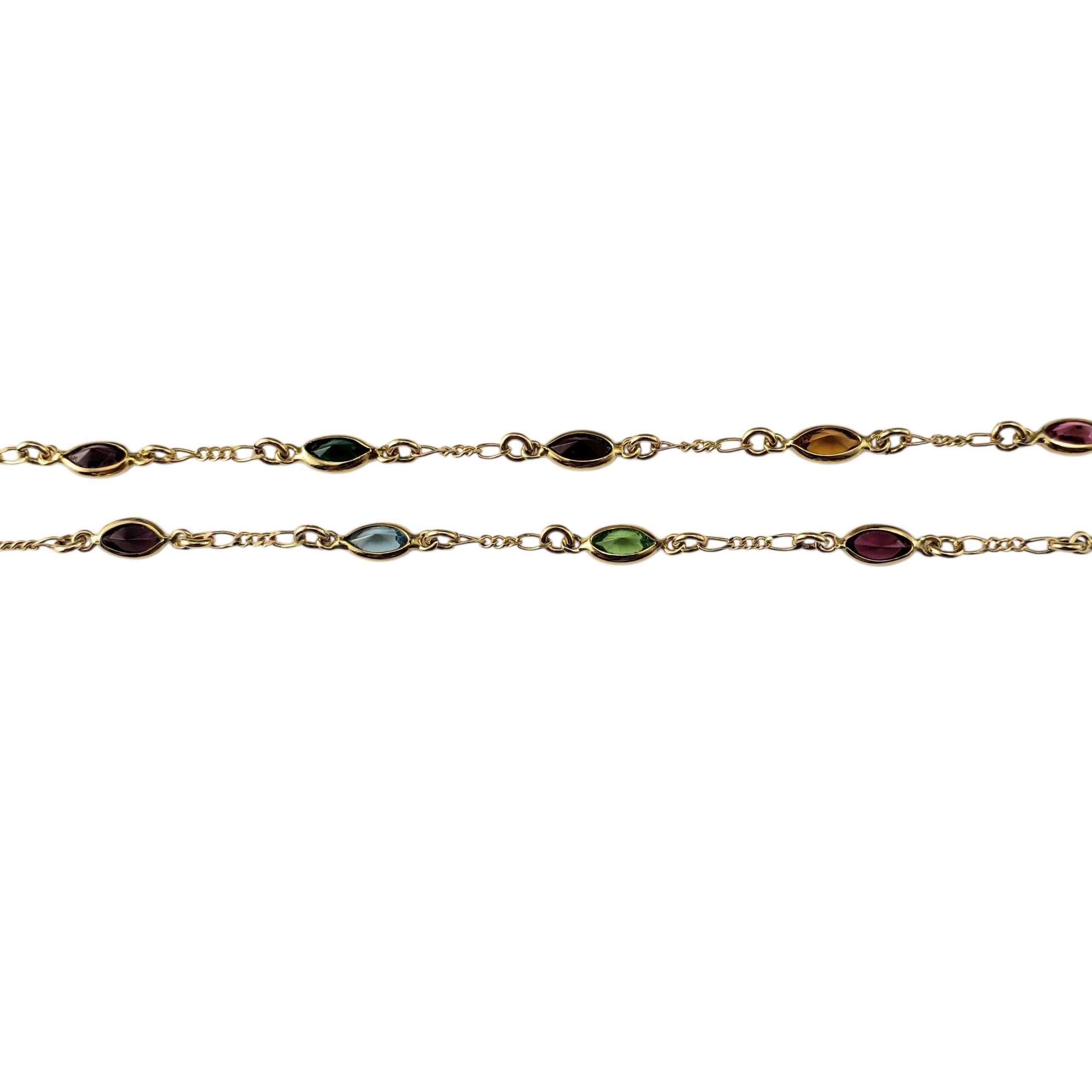 Collar de piedras preciosas de oro amarillo de 14 quilates

Colorido y elegante, este collar de estación de oro amarillo de 14 quilates presenta un divertido conjunto de gemas en forma de marquesa engastadas en bisel en un arco iris de