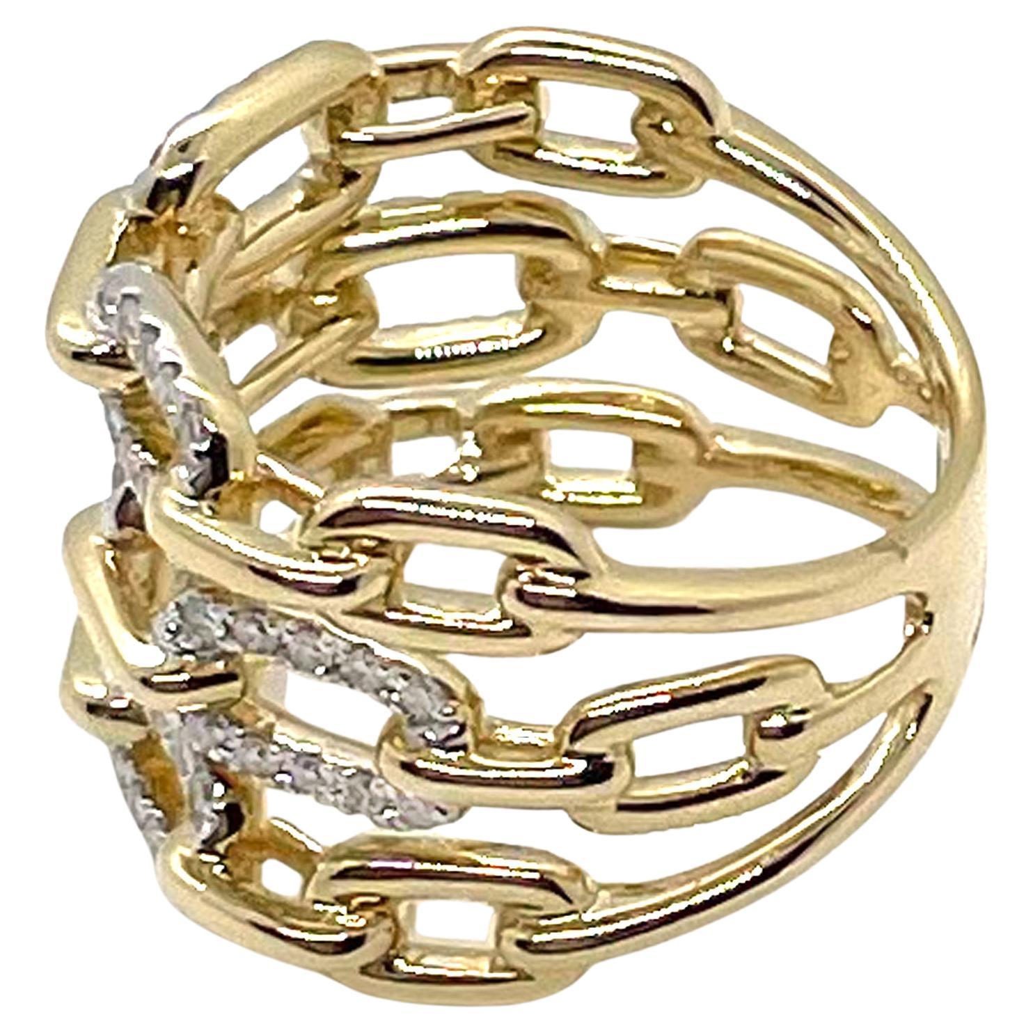 14K yellow gold ring with three rows of paperclip links and 0.55 carat round brilliant-cut diamonds.

* Diamonds are H color, SI1 clarity.
* Finger size 6.5
* The top is 15.3mm wide and tapers down to 6.2mm wide.