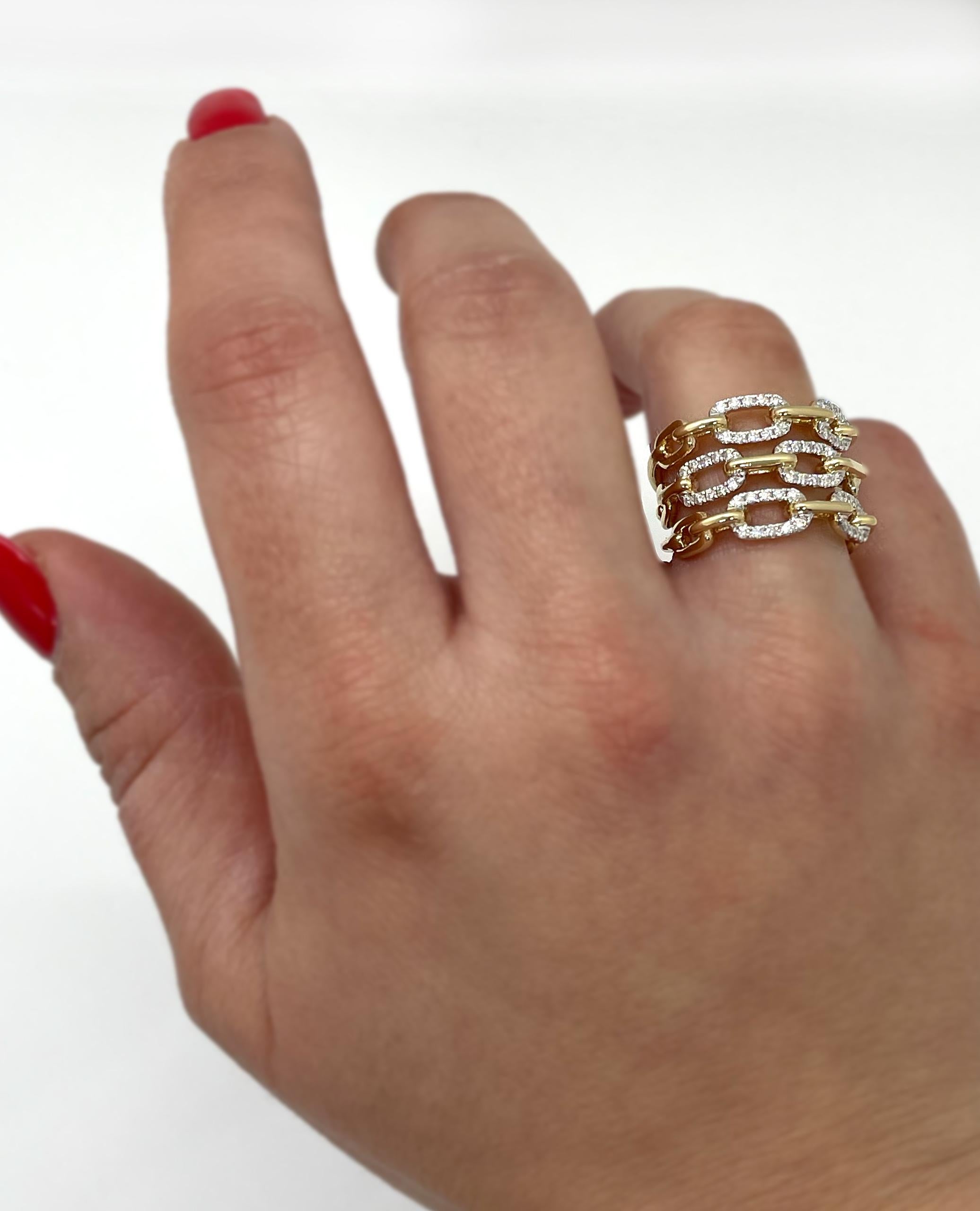 14K yellow gold ring with three rows of paperclip links and 0.55 carat round brilliant-cut diamonds.

* Diamonds are H color, SI1 clarity.
* Finger size 6.5
* The top is 15.3mm wide and tapers down to 6.2mm wide.
