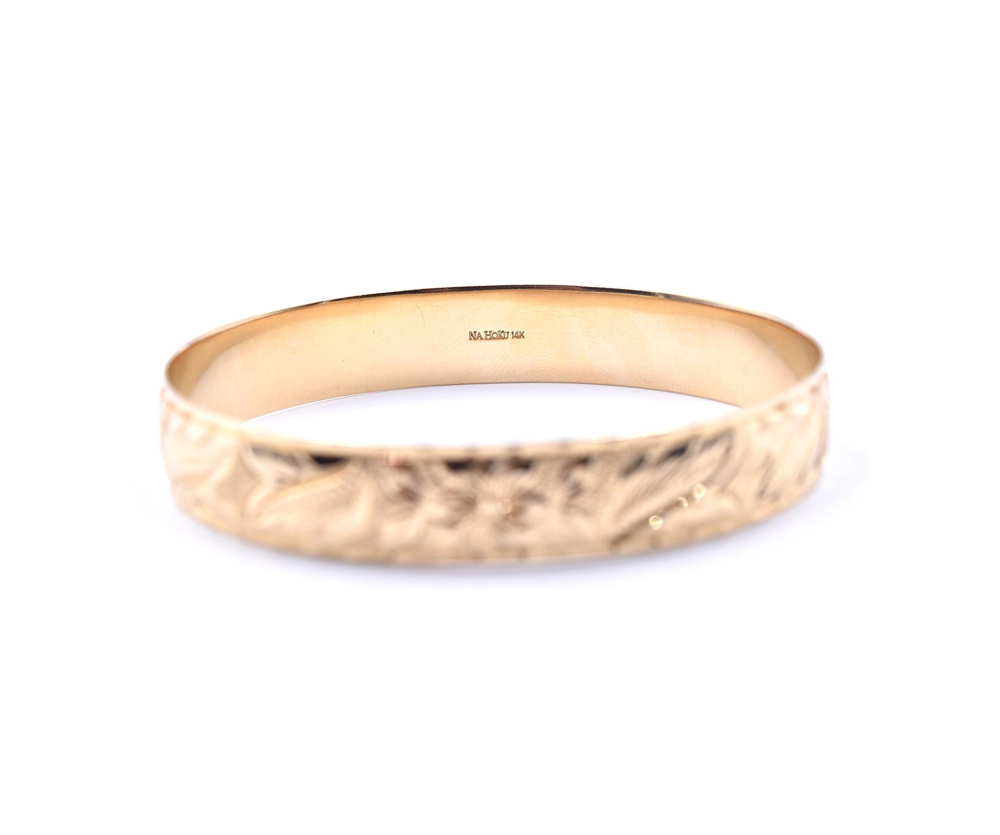 Designer: Nahoku
Material: 14k yellow gold
Dimensions: bracelet will fir an 8-inch wrist and it is 12mm wide
Weight: 36.94 grams