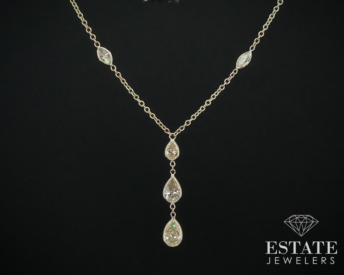 Sparkling lariat style Y necklace with pear cut cut diamonds in the middle and marquise diamonds on the sides. Approximately 3.22ctw of diamonds in total. SI-I1 clarity and a lovely light yellow color to the middle diamonds. 18