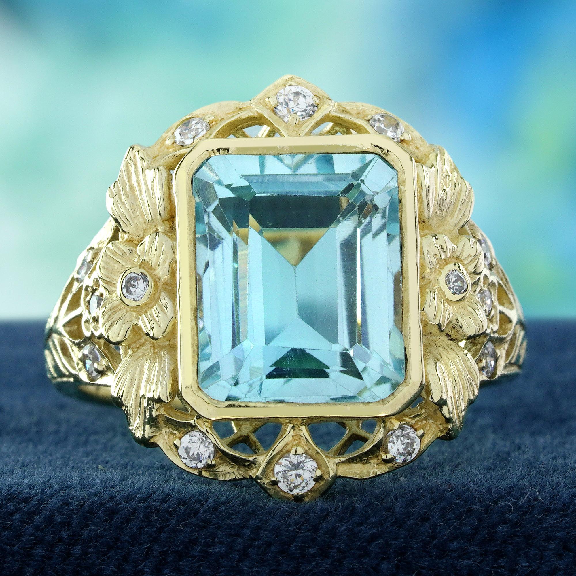 Une étonnante topaze bleue de taille émeraude qui brille d'un éclat bleu clair et apaisant. Les épaules de la bague sont magnifiquement travaillées avec un filigrane délicat, accentué par des perles douces qui ajoutent une touche de romantisme