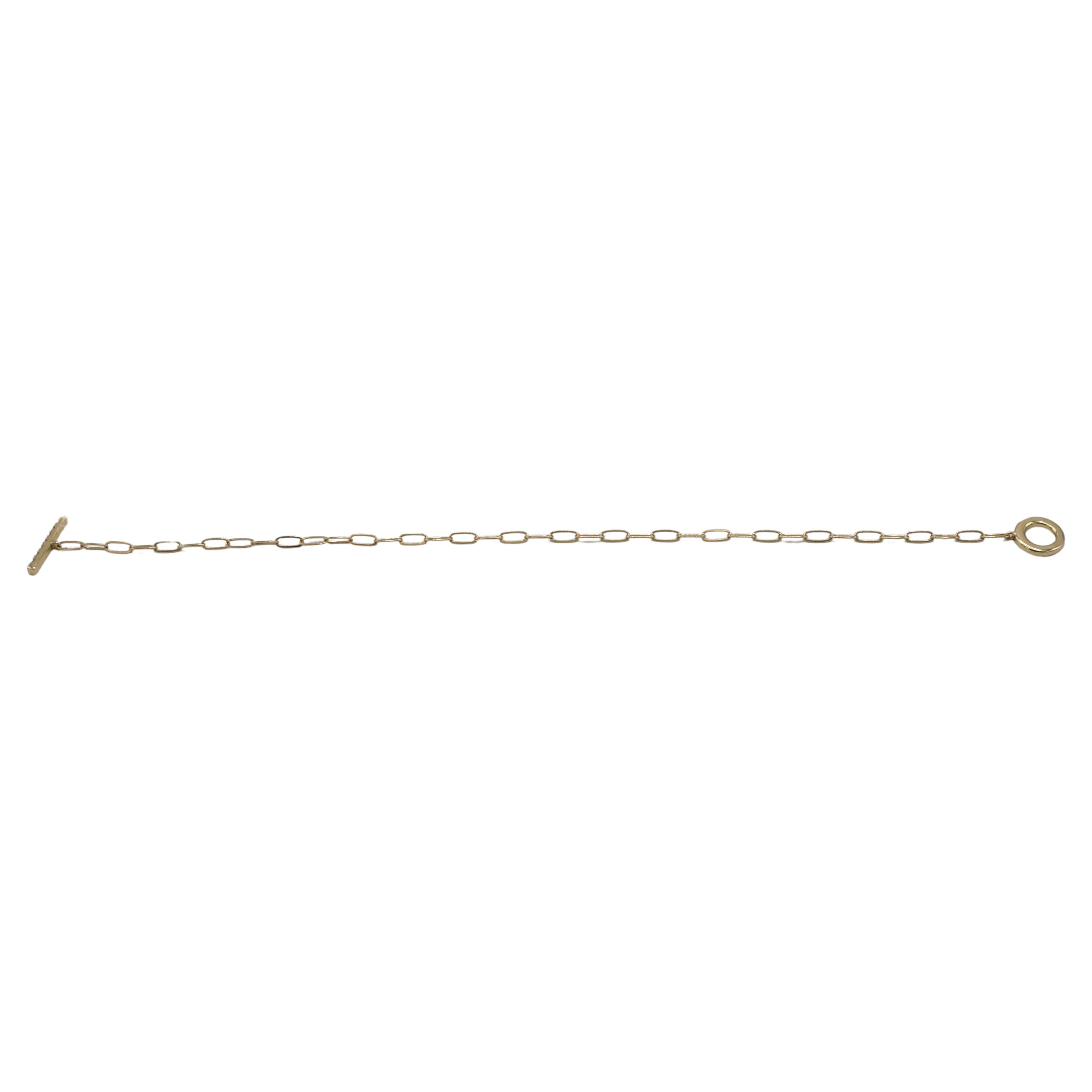 14K Yellow Gold Natural Diamond Paper Clip Chain Link Circle Toggle Bracelet 
Metal: 14k yellow gold
Weight: 1.93 grams
Diamonds: Approx. .10 CTW round G-H SI round natural diamonds
Length: 7 inches

