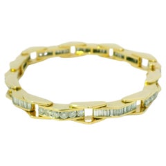 Bracelet en or jaune 14 carats serti de diamants naturels taillés en brillant rond et en baguette