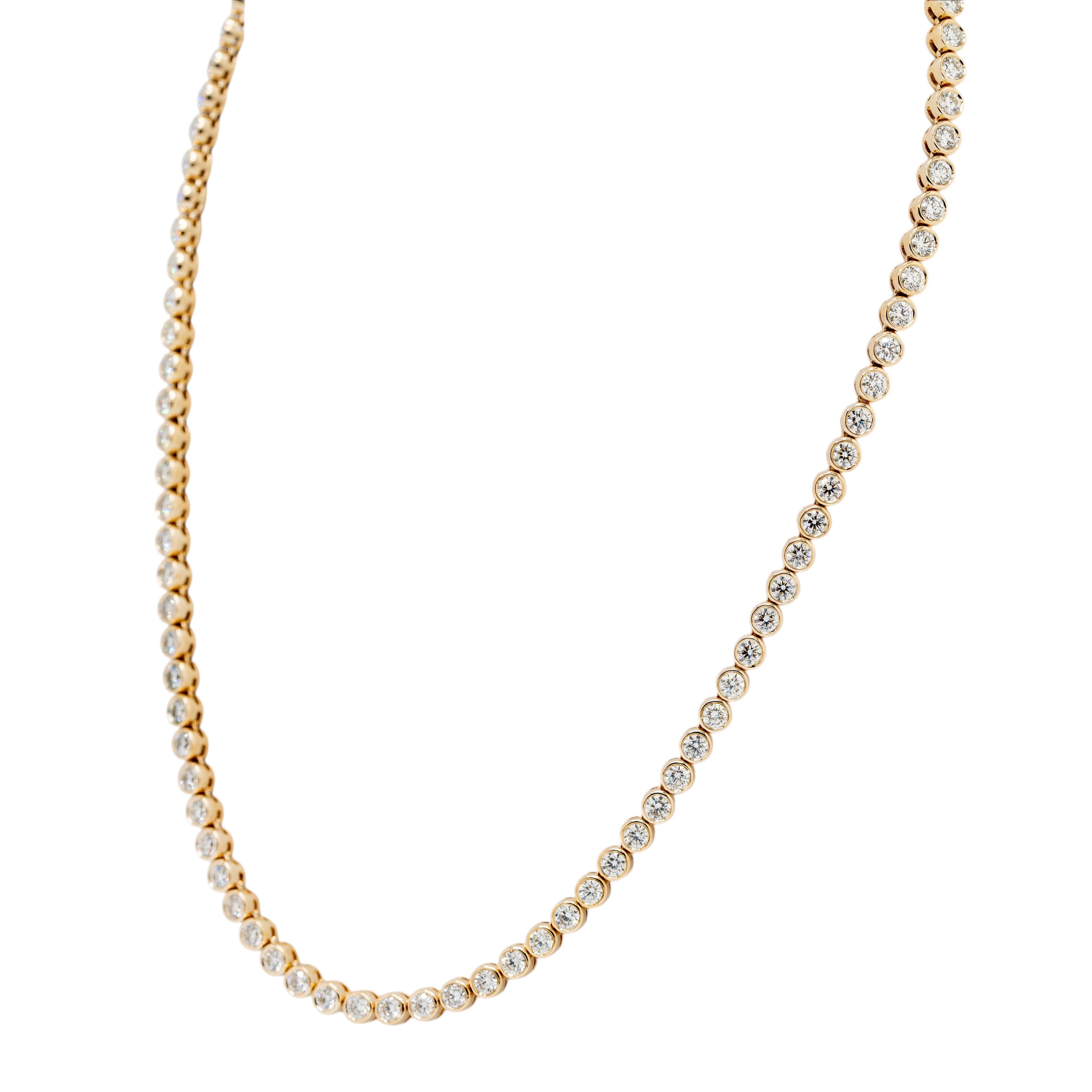 This luxurious 14k yellow gold tennis necklace showcases the timeless elegance of natural round brilliant diamonds, set in a stunning beaded design. With a total diamond weight of 9.69 carats, each diamond sparkles brilliantly, adding an air of