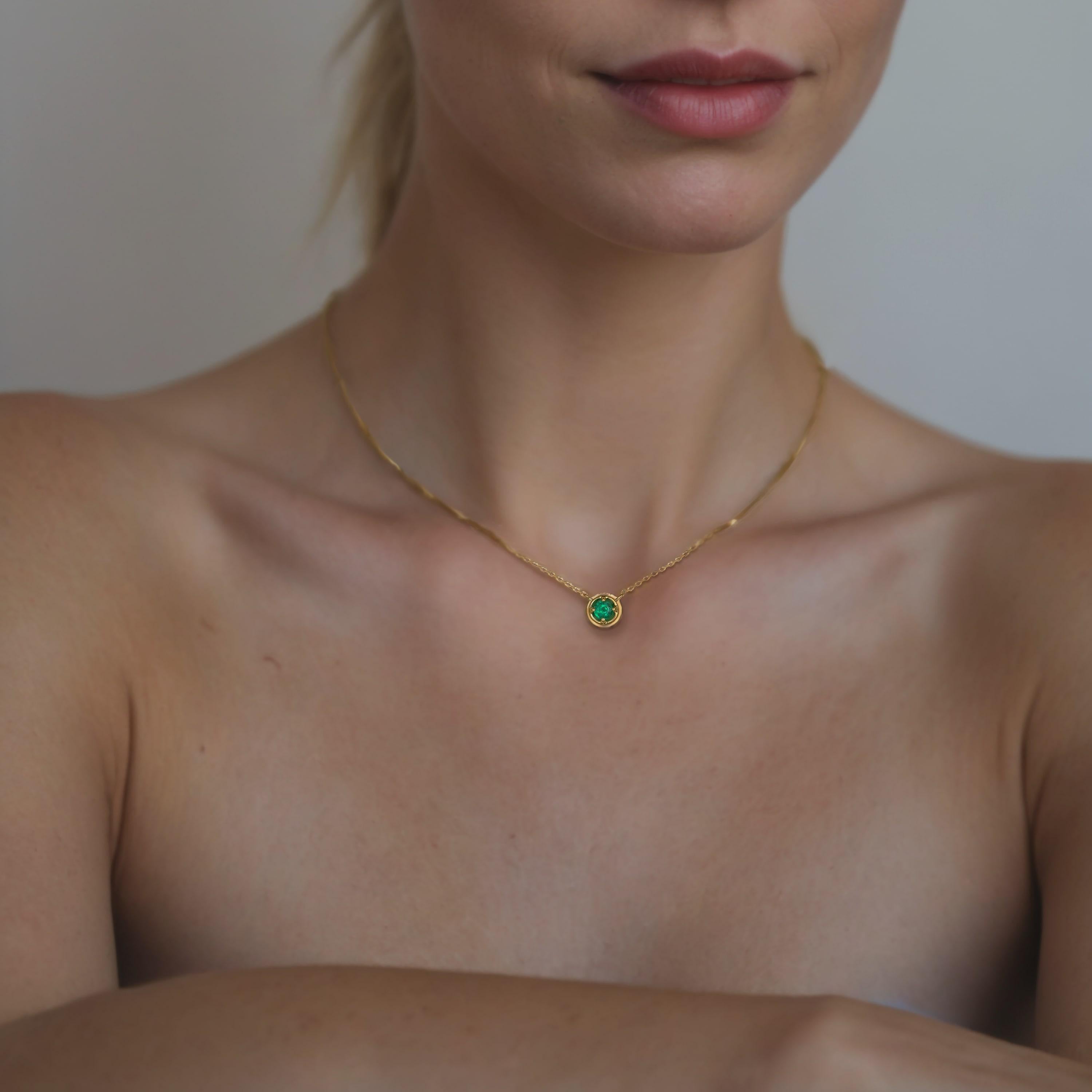 This Solitaire Round Emerald 14K Yellow Gold Necklace combines classic elegance with modern simplicity, making it a versatile piece that effortlessly enhances any look. Handcrafted with meticulous attention to detail, the necklace radiates a warm
