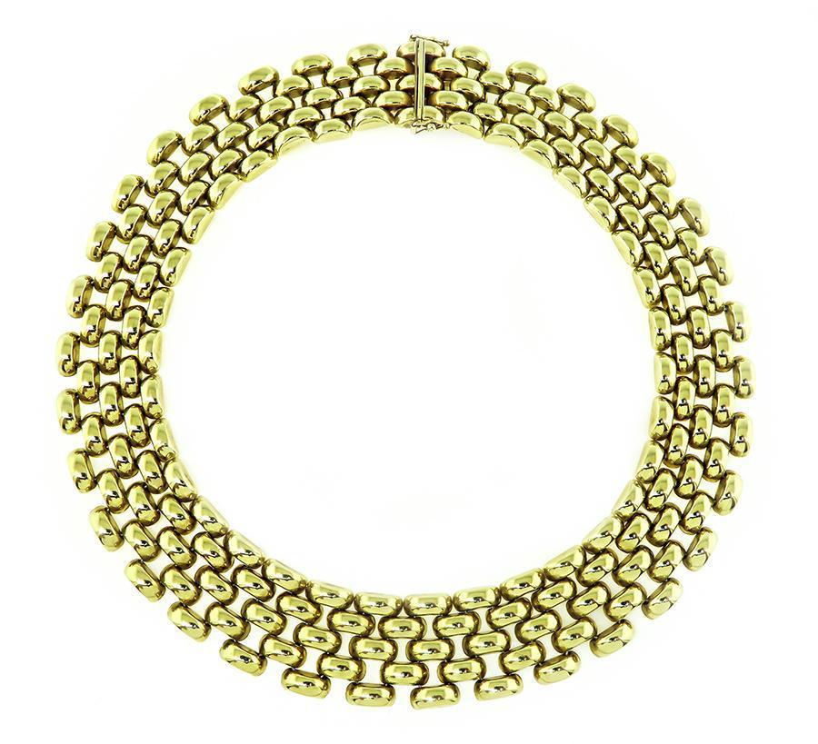 This is an amazing 14k yellow gold necklace. The necklace features impressive geometric design. The necklace measures 21.5mm in width and 16 inches in length. The necklace is stamped 14K ITALY and weighs 74.8 grams.