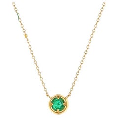 Collier solitaire en or jaune 14 carats avec émeraudes rondes
