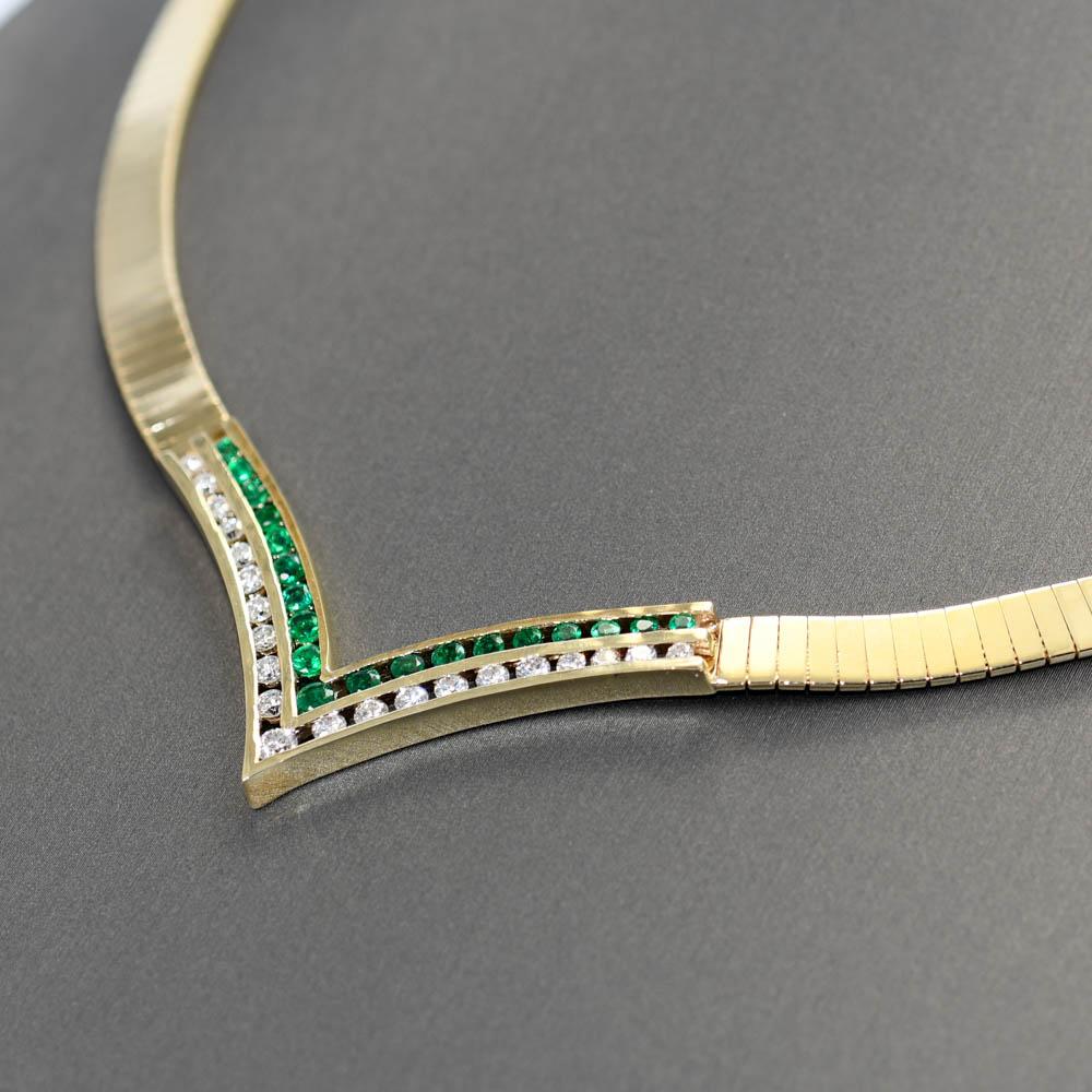 14k yellow gold necklace with diamonds and emeralds.
Stamped 14k and weighs 39 grams.
The diamonds are round brilliant cuts in channel setting, 1.00 total carats, G, H, i color, Si clarity, very good cuts.
The natural emeralds are round brilliant