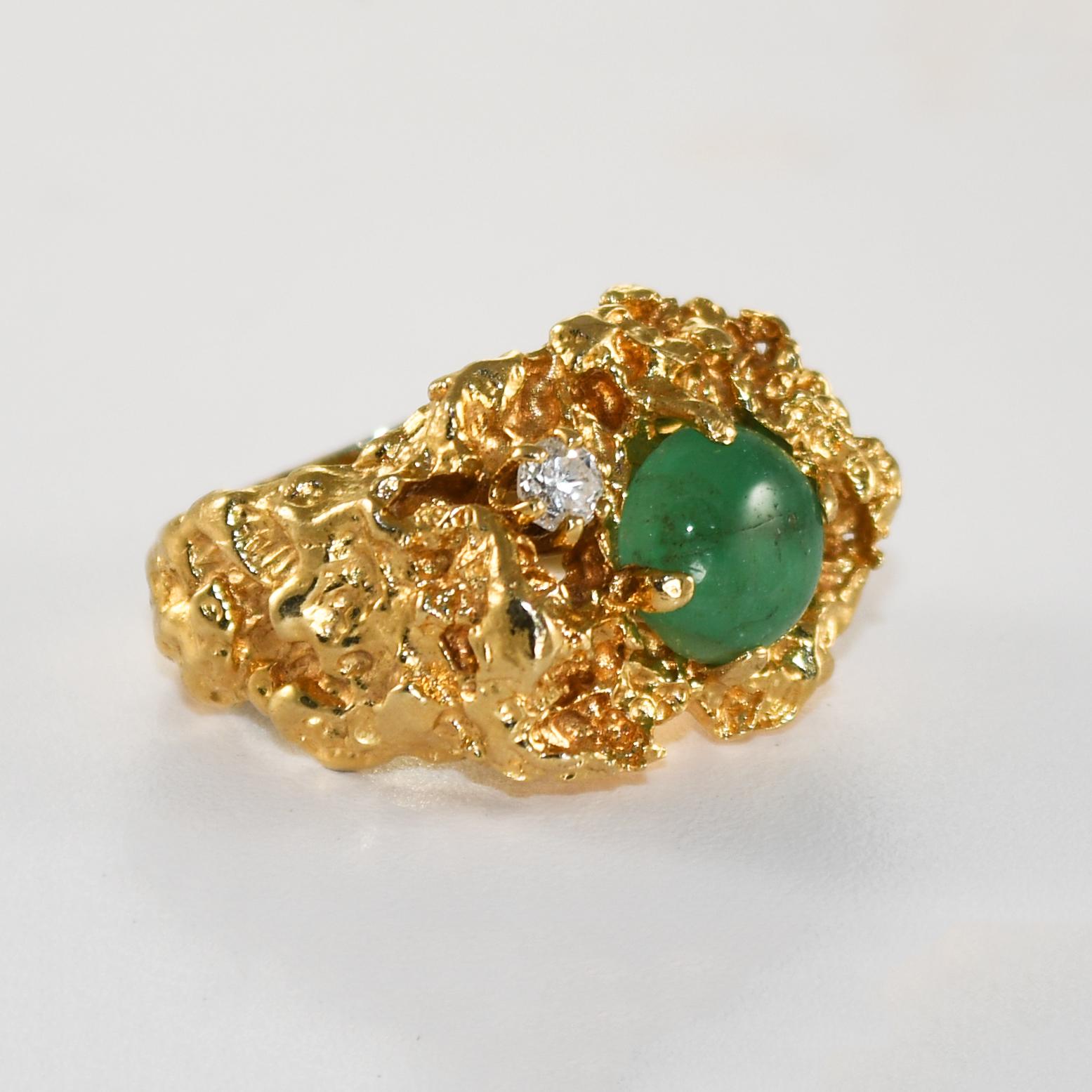 Unisex 14k yellow gold ring with emerald and diamond.
Nugget style ring tests 57% gold and weighs 16.8 grams.
The emerald is a light green, cabochon cut, 9 x 8.8x 3.9mm.
The diamond is a .12 carat round brilliant cut, H to I color, Si clarity.
The