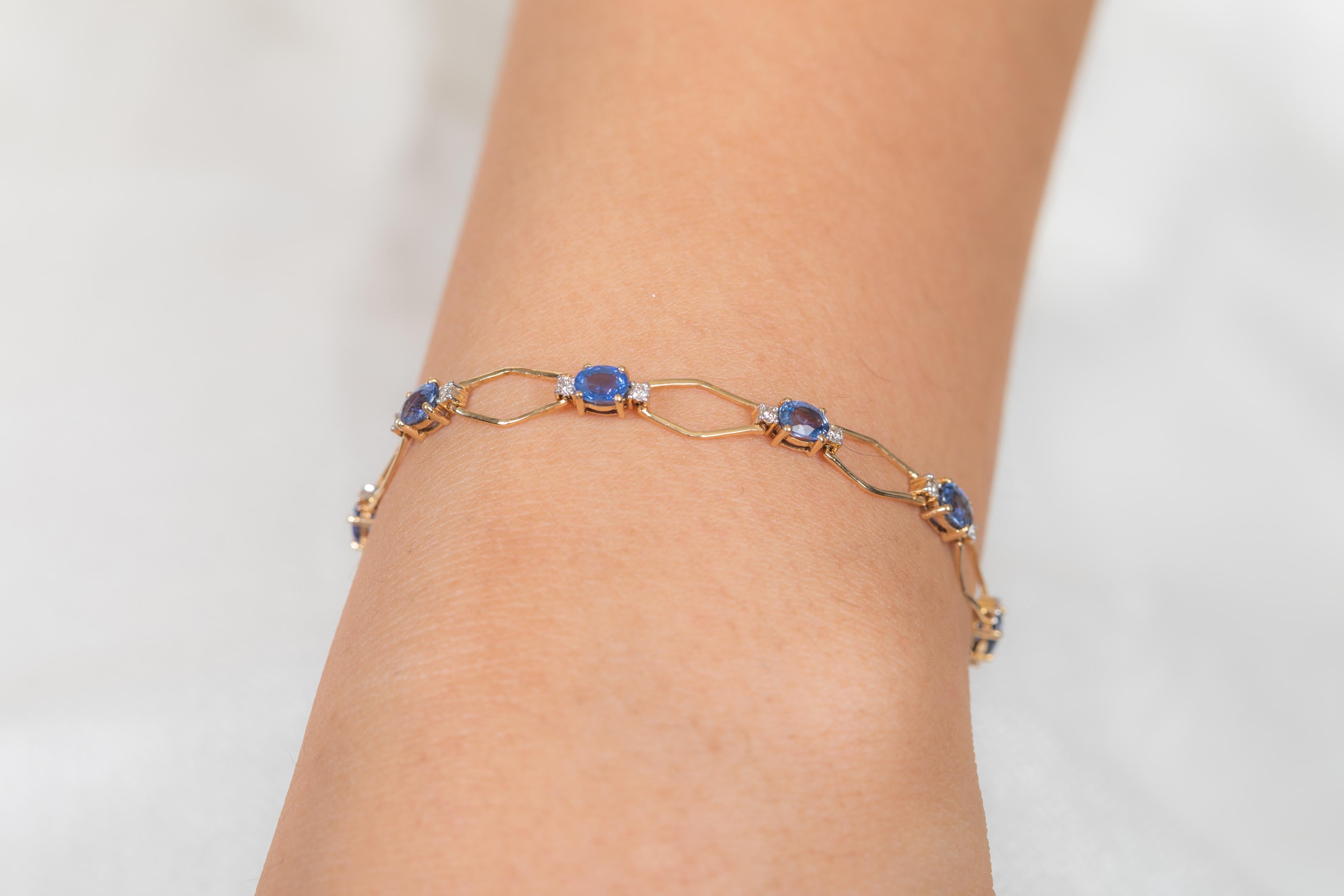 The wearing of charms may have begun as a form of amulet or talisman to ward off evil spirits or bad luck. 
This blue sapphire bracelet has a oval cut gemstone and diamonds in 18K Gold. A perfect piece of jewelry to adorn your jewelry