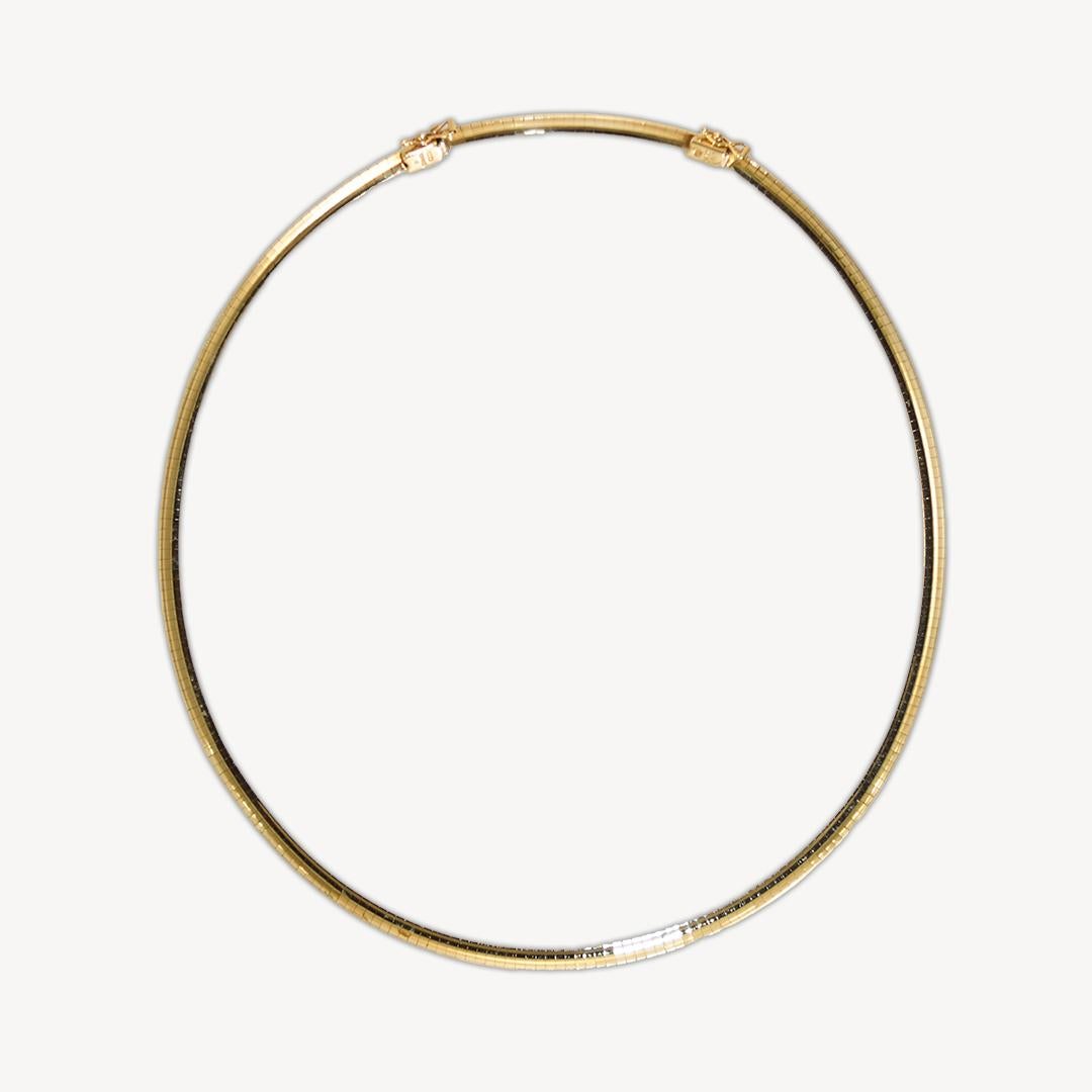14k yellow gold omega link necklace.
Stamped 14k and weighs 31.2 grams.
Using an XRF metal analyzer, it tests 56.5% gold content.
The necklace measures 18 inches long with a 2-inch extension.
The extension can be removed to shorten to 16 inches
