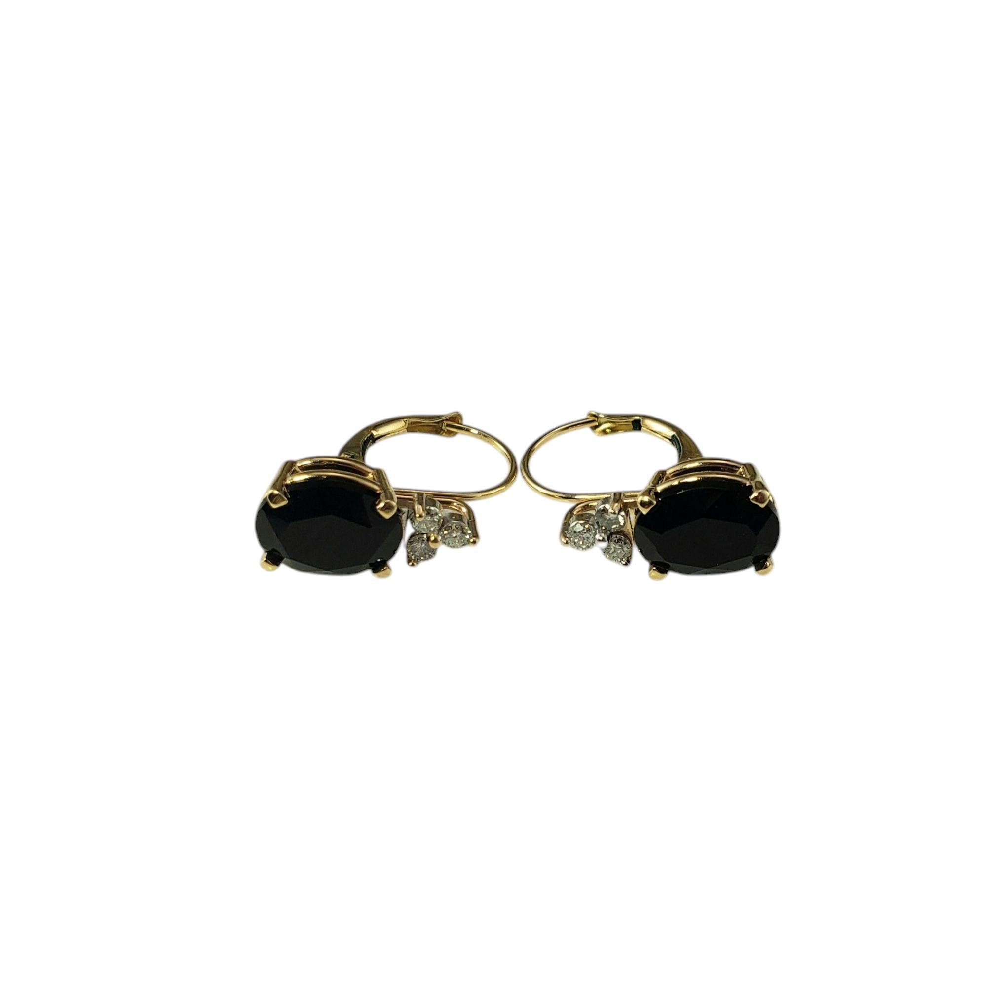 14K Yellow Gold Onyx and Diamond Earrings JAGi certified

These elegant earrings each feature one oval cut faceted black onyx gemstone and three round brilliant cut diamonds set in classic 10K yellow gold. Lever back closures.

Approximate total