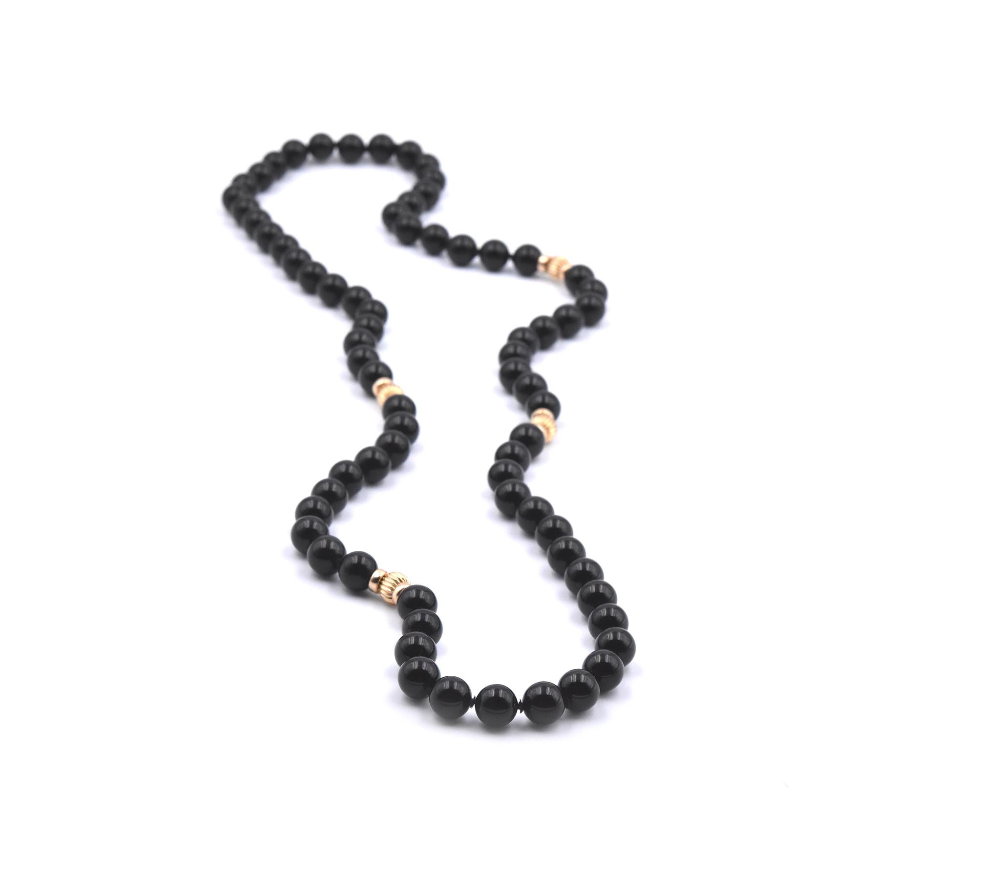 Designer: custom designed
Material: 14k yellow gold
Onyx: 10mm onyx beads
Dimensions: necklace is 32 inches long
Weight: 100.35 grams
