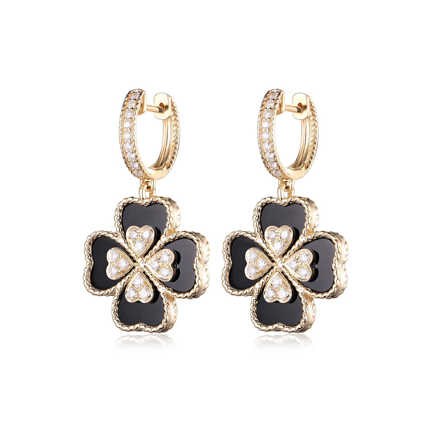 Elevate your style with these charming clover-shaped earrings, each showcasing the striking contrast between the deep black of 11.10 carats of polished onyx and the radiant sparkle of 0.78 carats of diamonds. The onyx, meticulously carved into the
