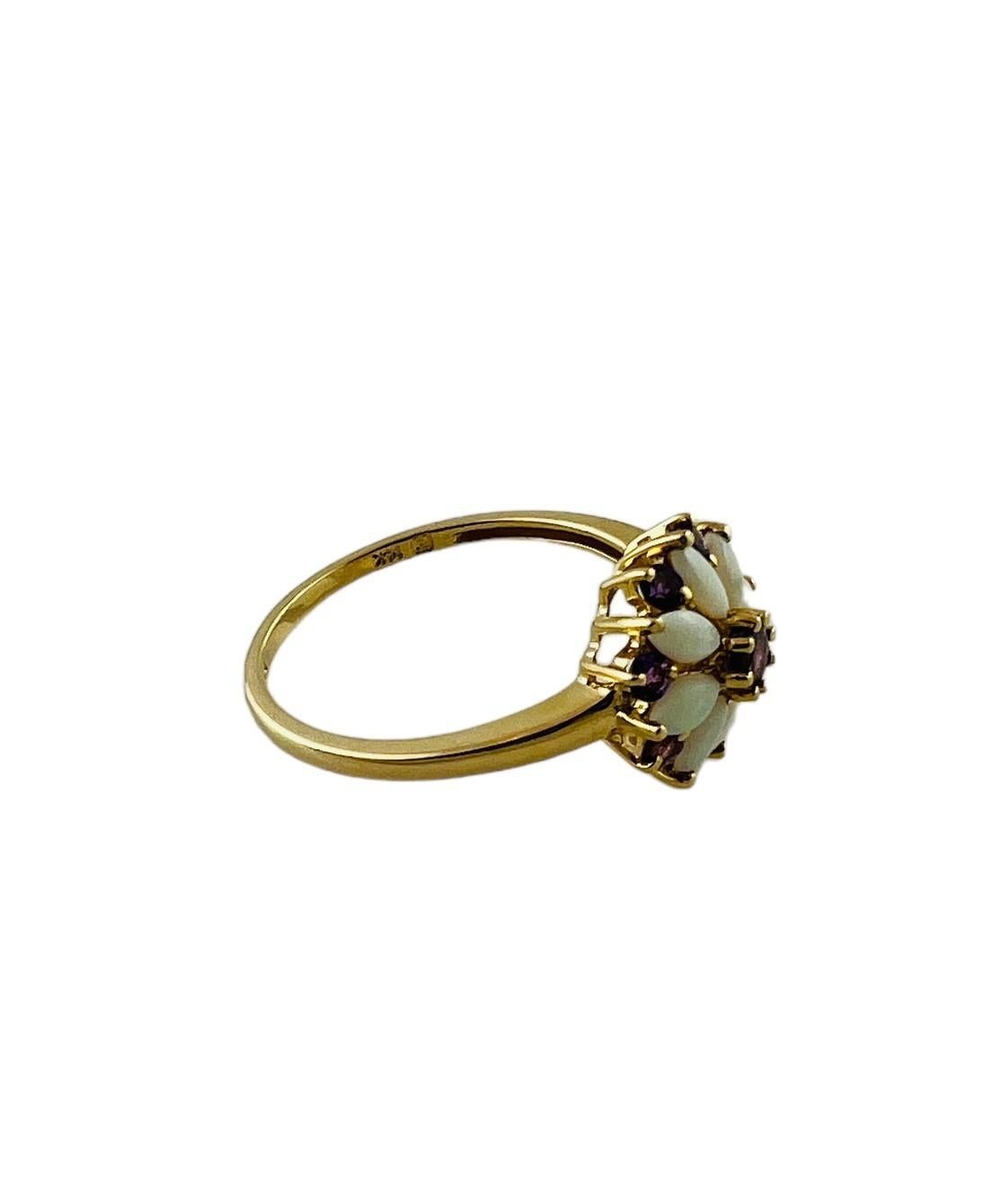 14K Yellow Gold Opal and Amethyst Ring

This beautiful ring is set in 14K yellow gold. 

The flower motif of the front of the ring is created by 8 oval opals and 9 round amethysts

Size 8.25

 shank 1.5mm

Front of ring is approx. 12mm in