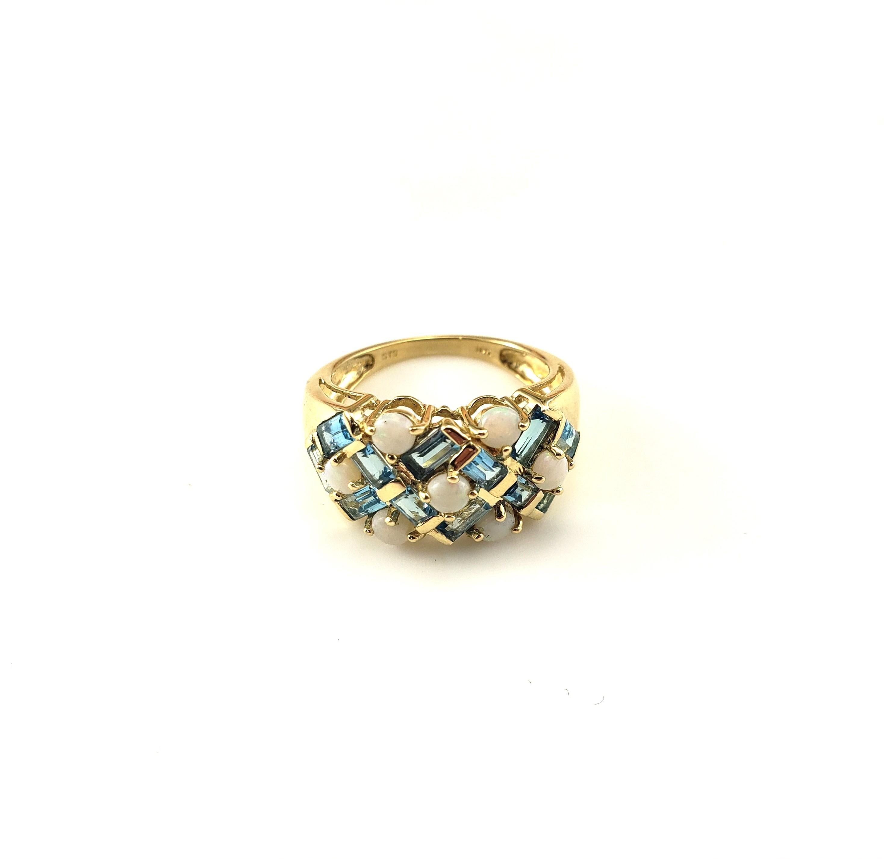 14K Yellow Gold Opal and Blue Topaz Ring Size 6

This stunning ring feature seven round opal stones and 12 baguette cut blue topaz stones set in classic 14K yellow gold.  

Width:  11 mm.  Shank: 2 mm.

Ring Size: 6

Stamped: 14K

Weight: 2.6