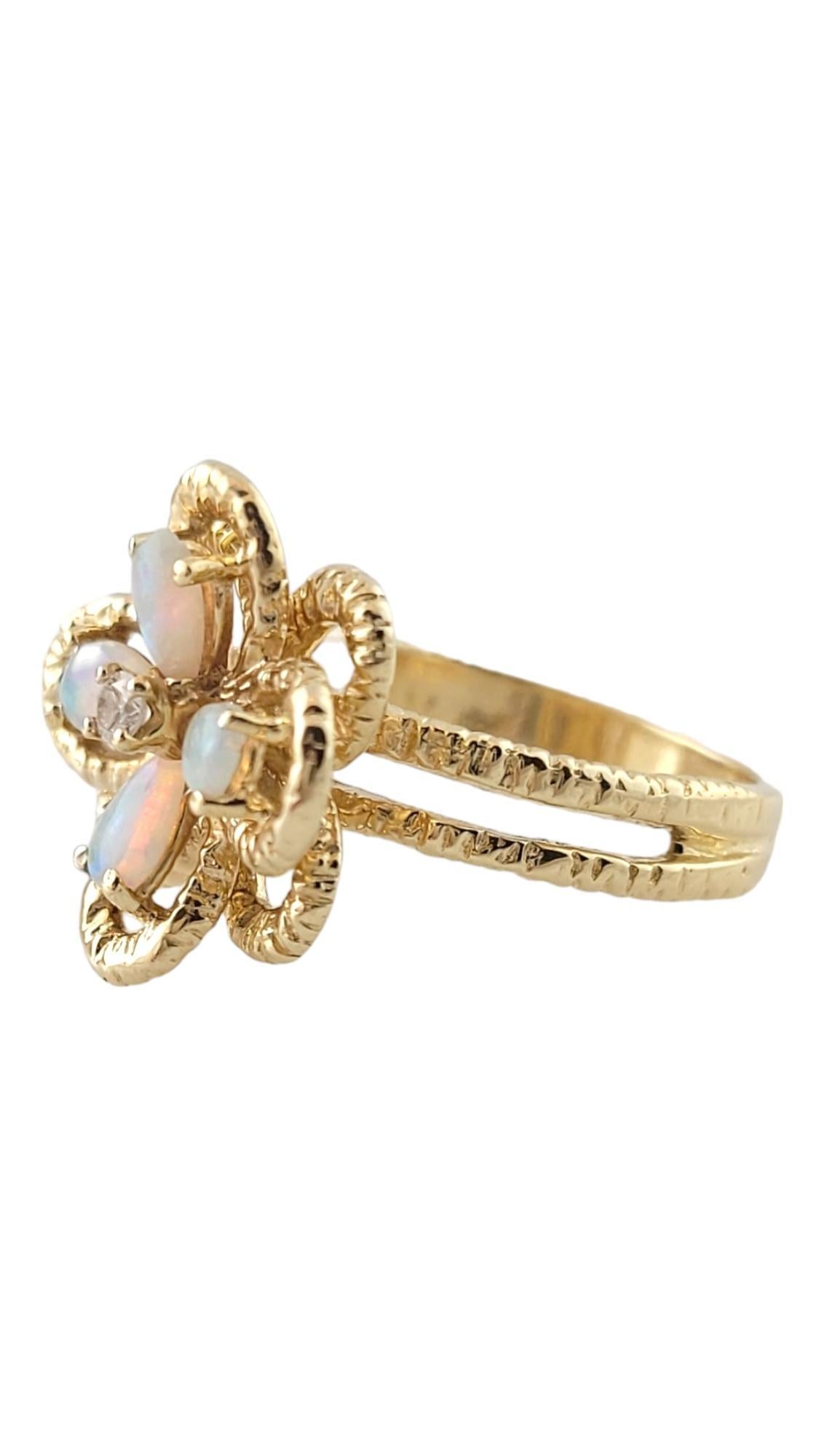 Vintage 14K Yellow Gold Opal and Diamond Ring Size 6.5

This beautiful ring has a gorgeous 14K yellow gold flower decorated with opal pedals and a round brilliant cut diamond center!

Approximate total diamond weight: .02 cts

Diamond color: