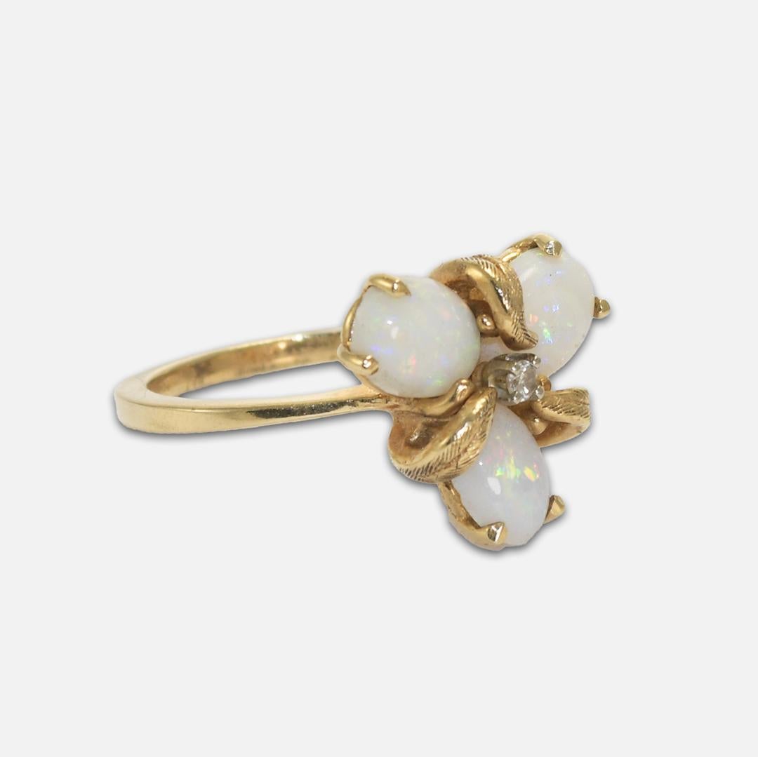 14K yellow gold opal and diamond ring.
Three-stone leaf.
Size 6.