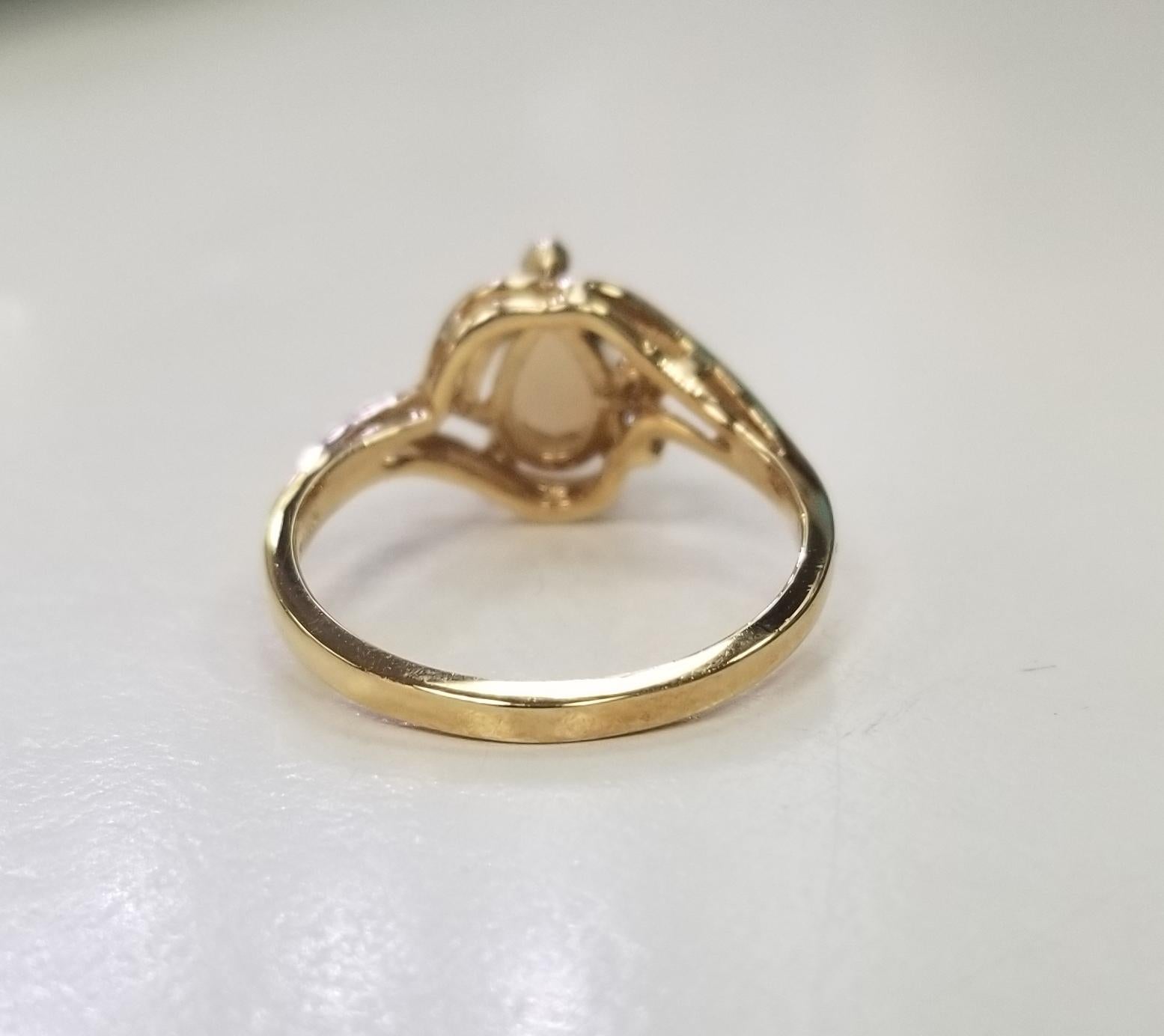 Contemporary 14 Karat Yellow Gold Opal and Diamond Ring For Sale