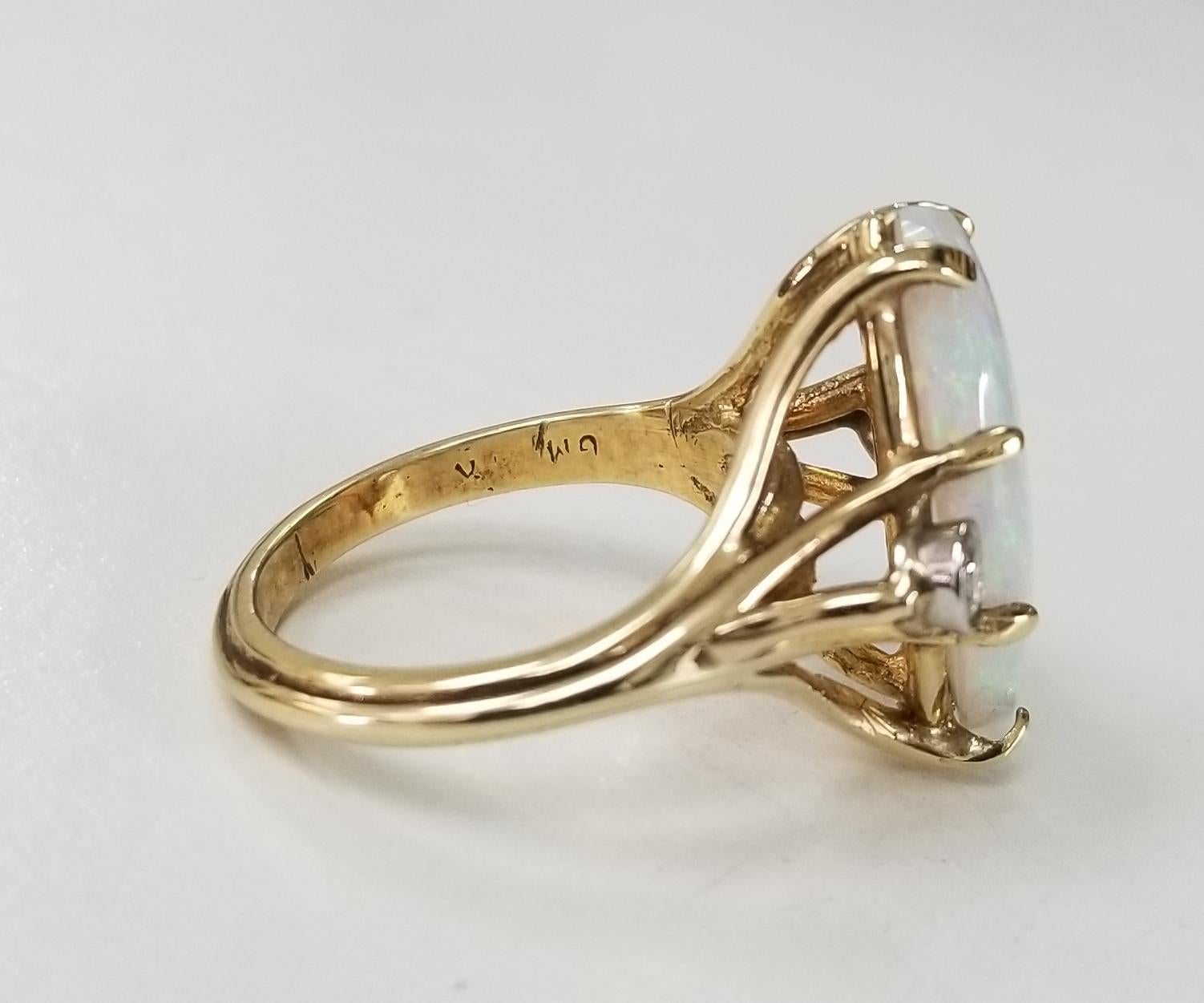 Contemporary 14 Karat Yellow Gold Opal and Diamond Ring