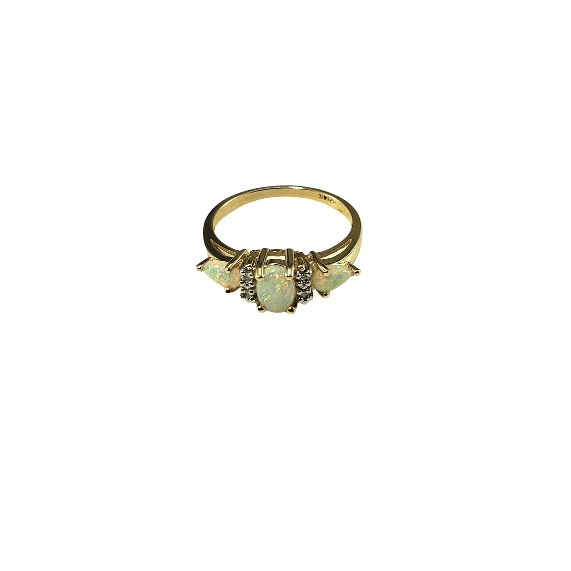 Vintage 14K Yellow Gold Opal and Diamond Ring Size 6-6.25-

This lovely ring features three opal gemstones and four round brilliant cut diamonds set in classic 14K yellow gold.  Width: 6 mm.  Shank: 1.5 mm.

Approximate total diamond weight: .04