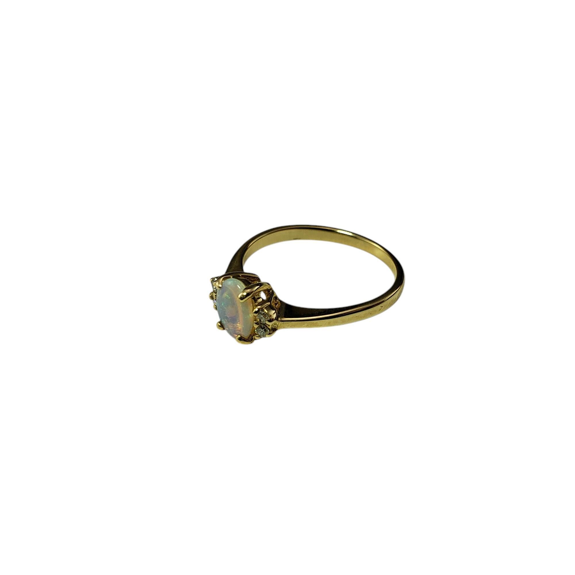 14 Karat Yellow Gold Opal and Diamond Ring Size 6.5-

This elegant ring features one oval opal gemstone (7 mm x 5 mm) accented with four round brilliant cut diamonds.

Shank: 2 mm.

Approximate total diamond weight: .04 ct.

Diamond color: