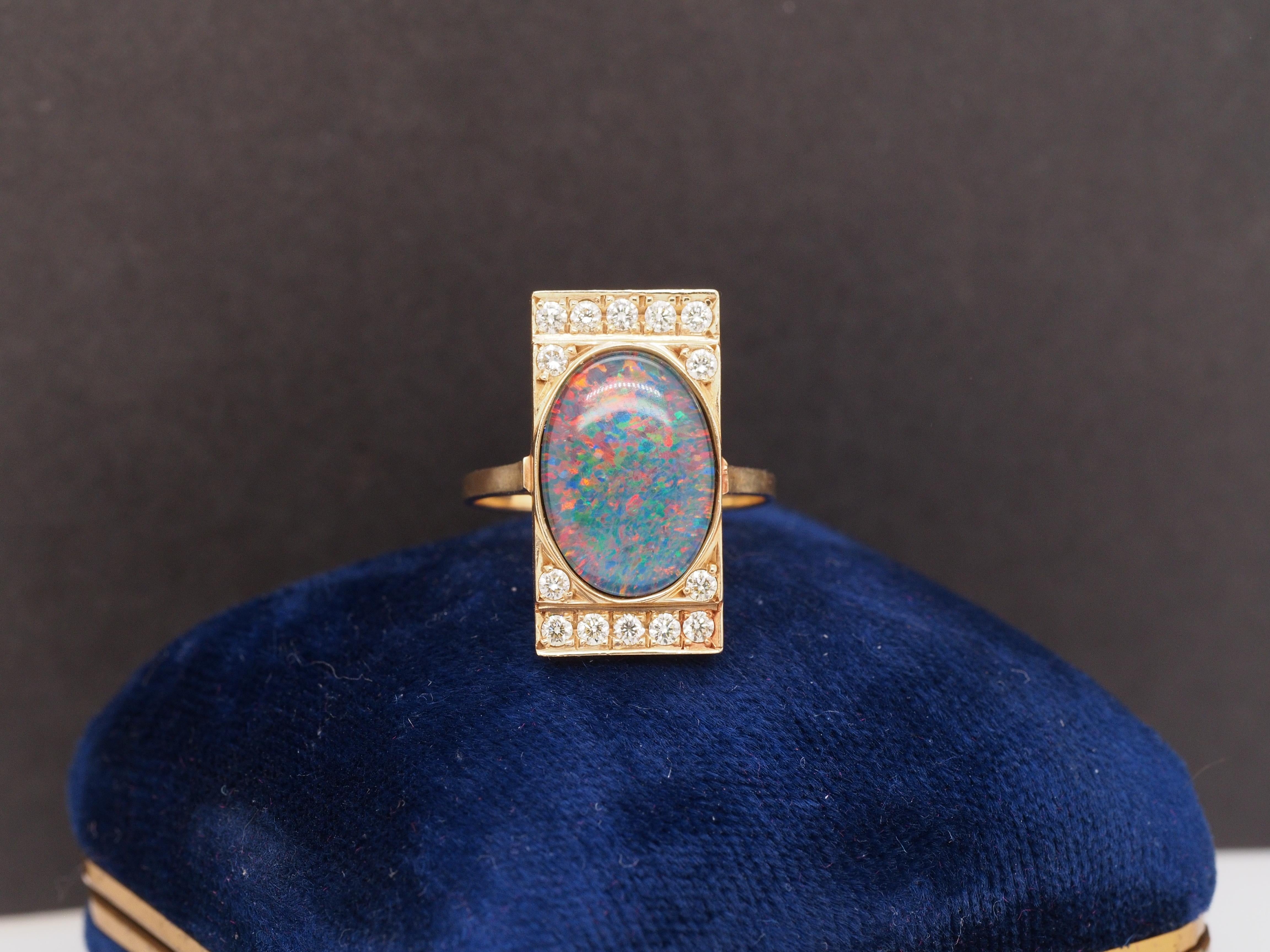 Year: 2000s
Item Details:
Ring Size: 7
Metal Type: 14K Yellow Gold [Hallmarked, and Tested]
Weight: 4.4 grams
Details:
Center Opal: Doublet, Color Play of Red, Green, Blue
Side Diamonds: .35ct, total weight. Natural Diamonds, Light Yellow Color, VS