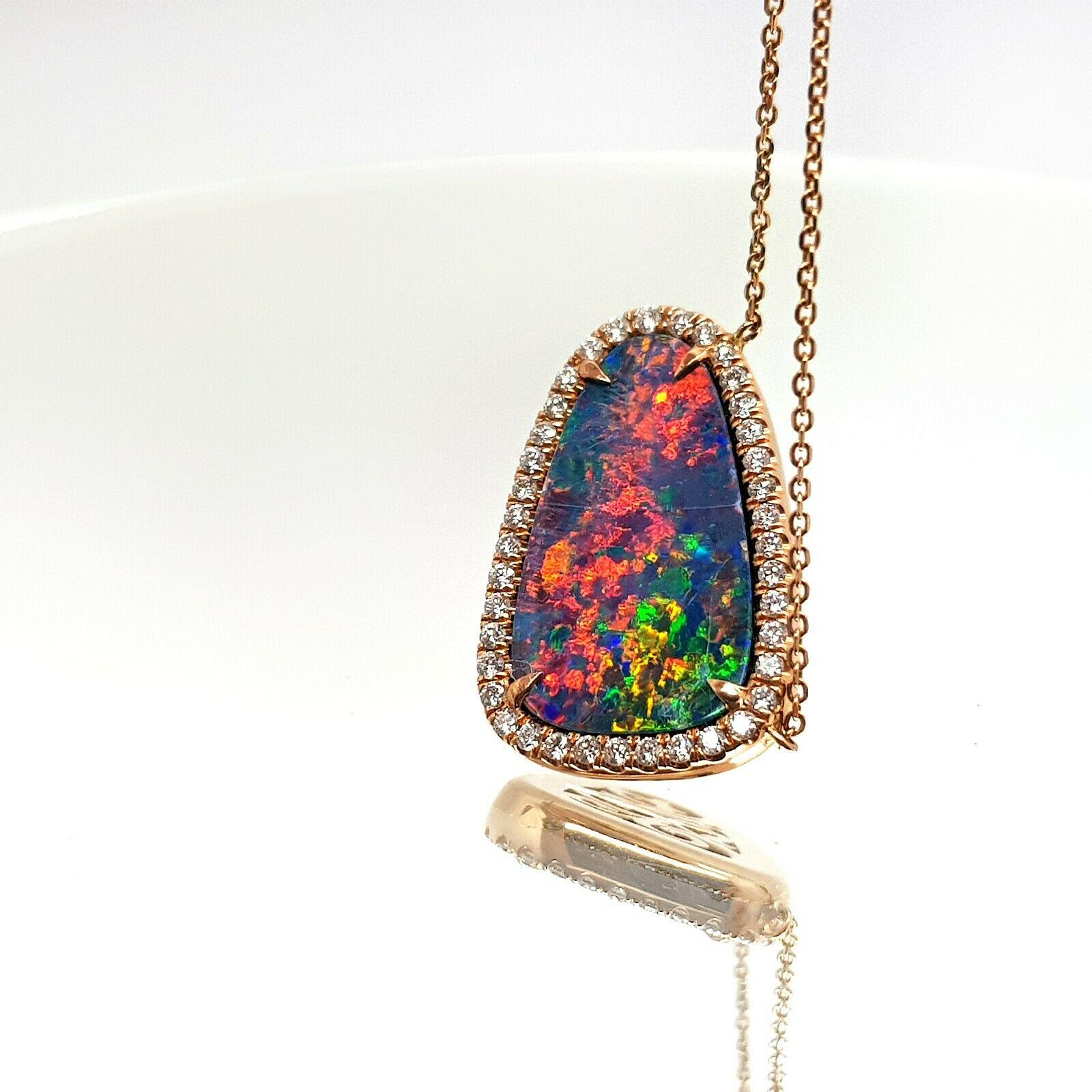  Specifications:
    main stone: OPAL DUBLET  21.7 x 14mm
    additional: DIAMONDS
    diamonds: 39 PCS
    carat total weight: 0.53
    color: G
    clarity: SI1
    brand: custom
    metal: 14k rose gold
    type: PENDANT
    weight: 10.01 GR
   