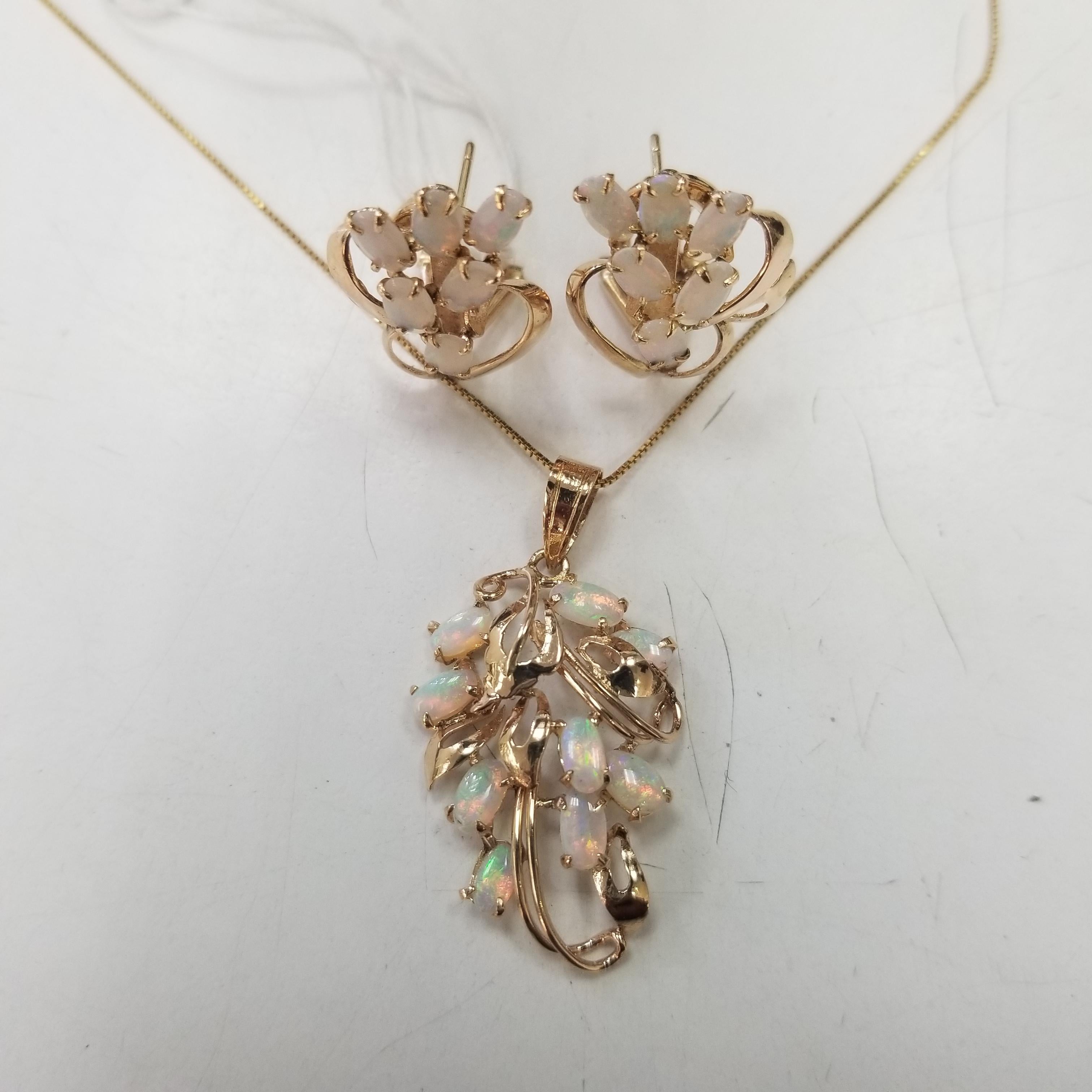 14k yellow gold opal pendant and earring set with 3.50 carats on an 18 inch chain. weighing 7.2 grams