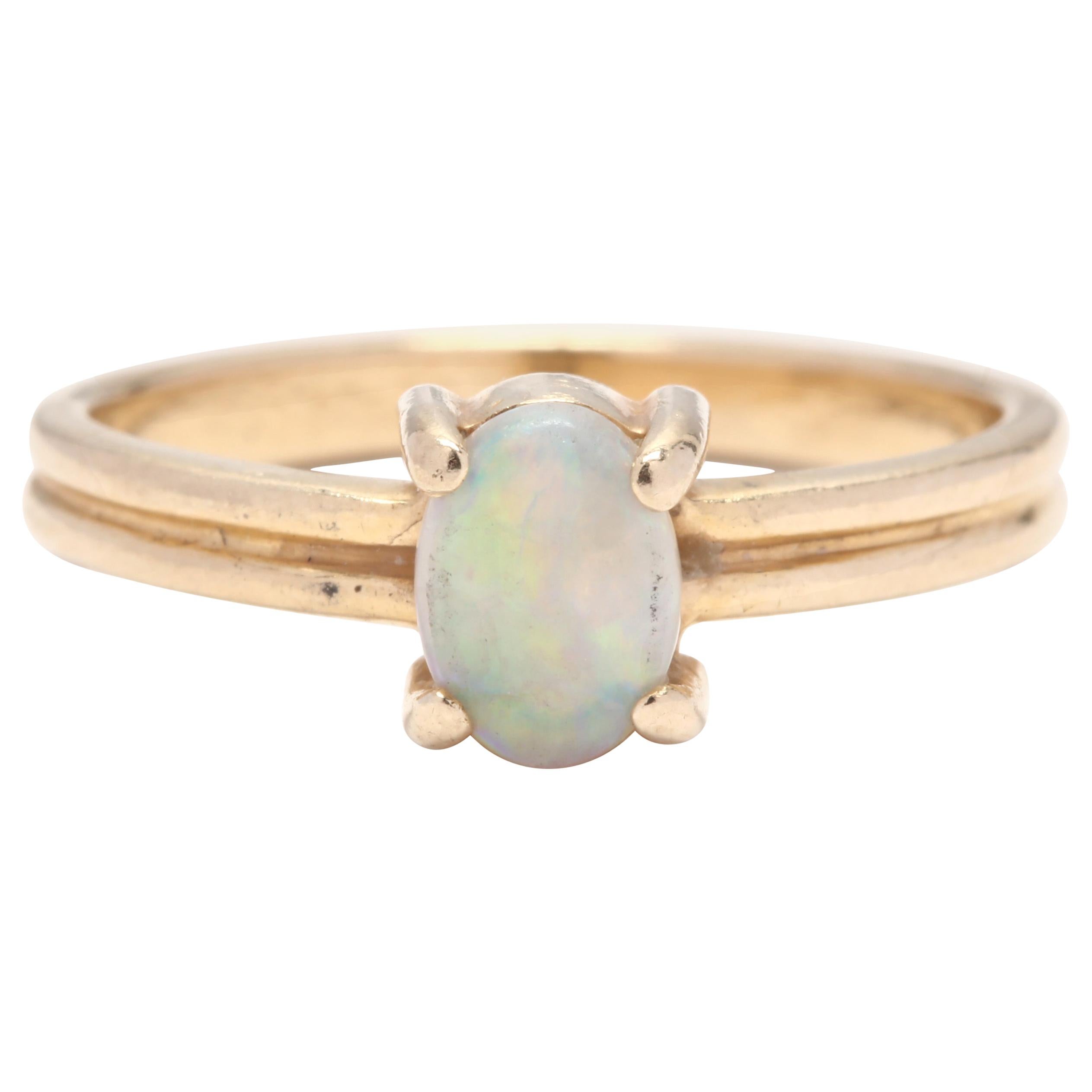 14 Karat Yellow Gold and Opal Solitaire Ring